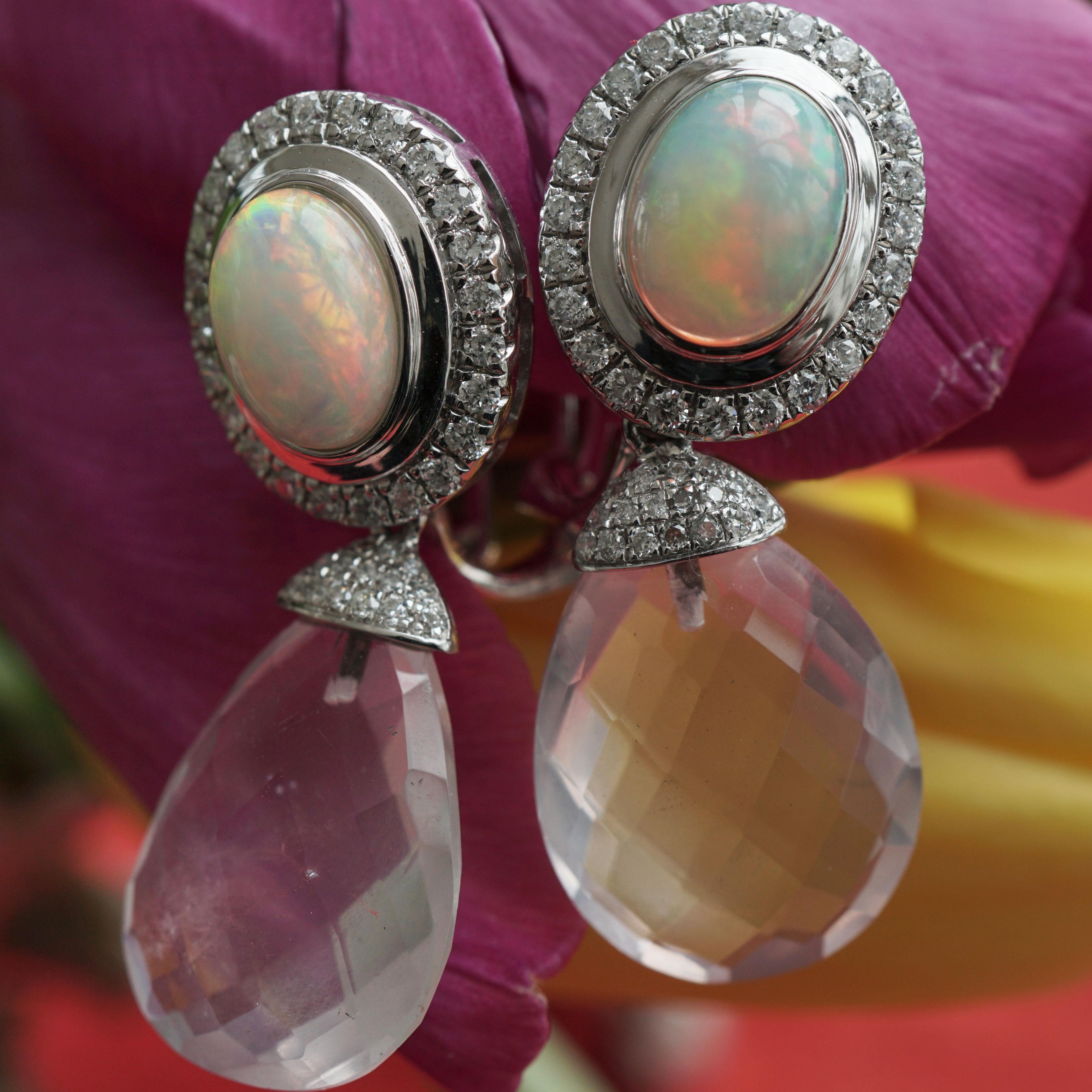 Pastel tones combined as magnificent earrings with clip device in 750 white gold, 2 faceted rose quartz pampas total approx. 13.10 ct, 2 full opals total approx. 1.90 ct, full cut brilliants total approx. 0.50 ct, W (white) / SI1-2 (small