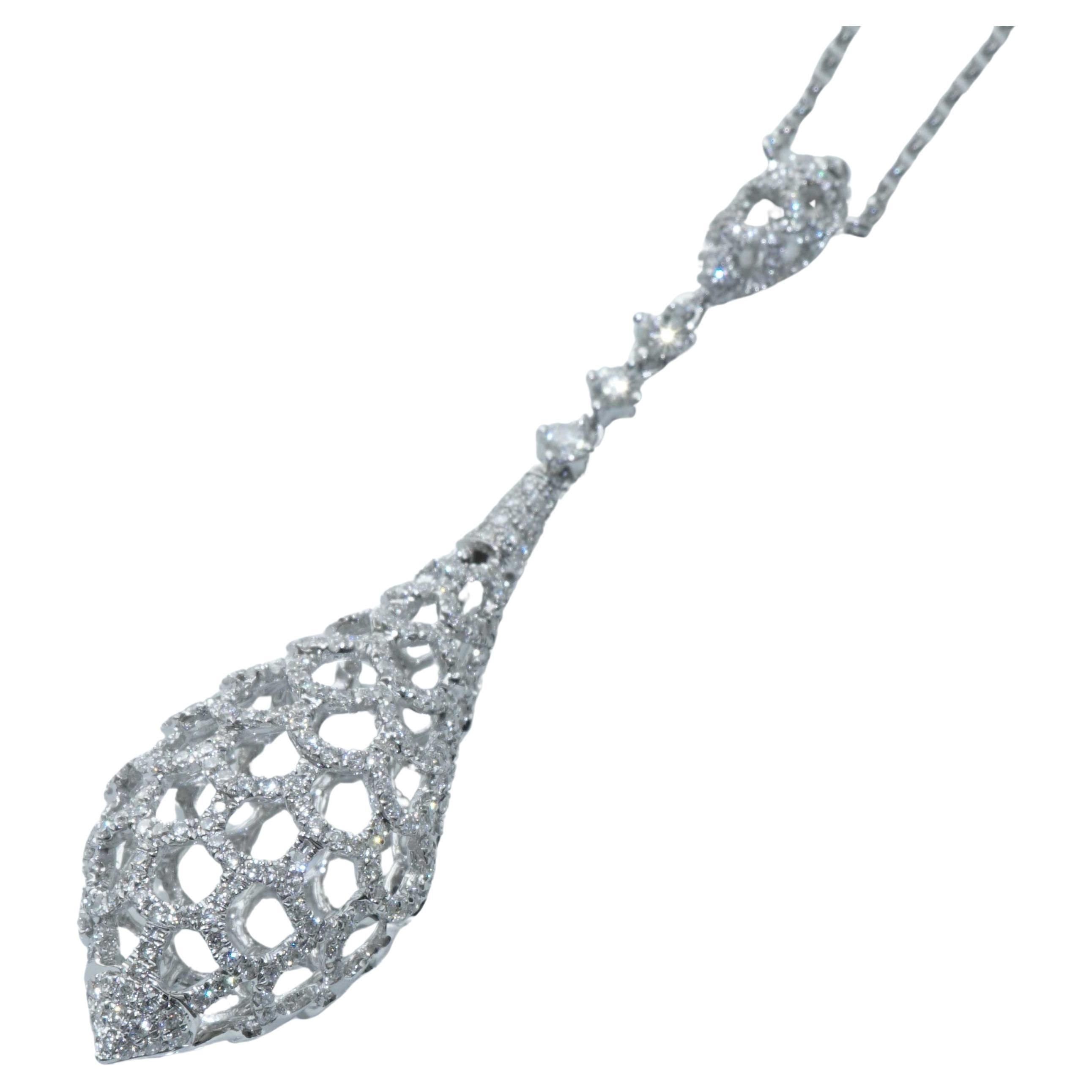 never seen exciting lattice shape pointed teardrop completely pierced in a flowing teardrop shape set with full-cut brilliant-cut diamonds with full-cut brilliant-cut diamonds totaling approx. 1.10 ct, TW-W / VVS-VS (very very small inclusions -