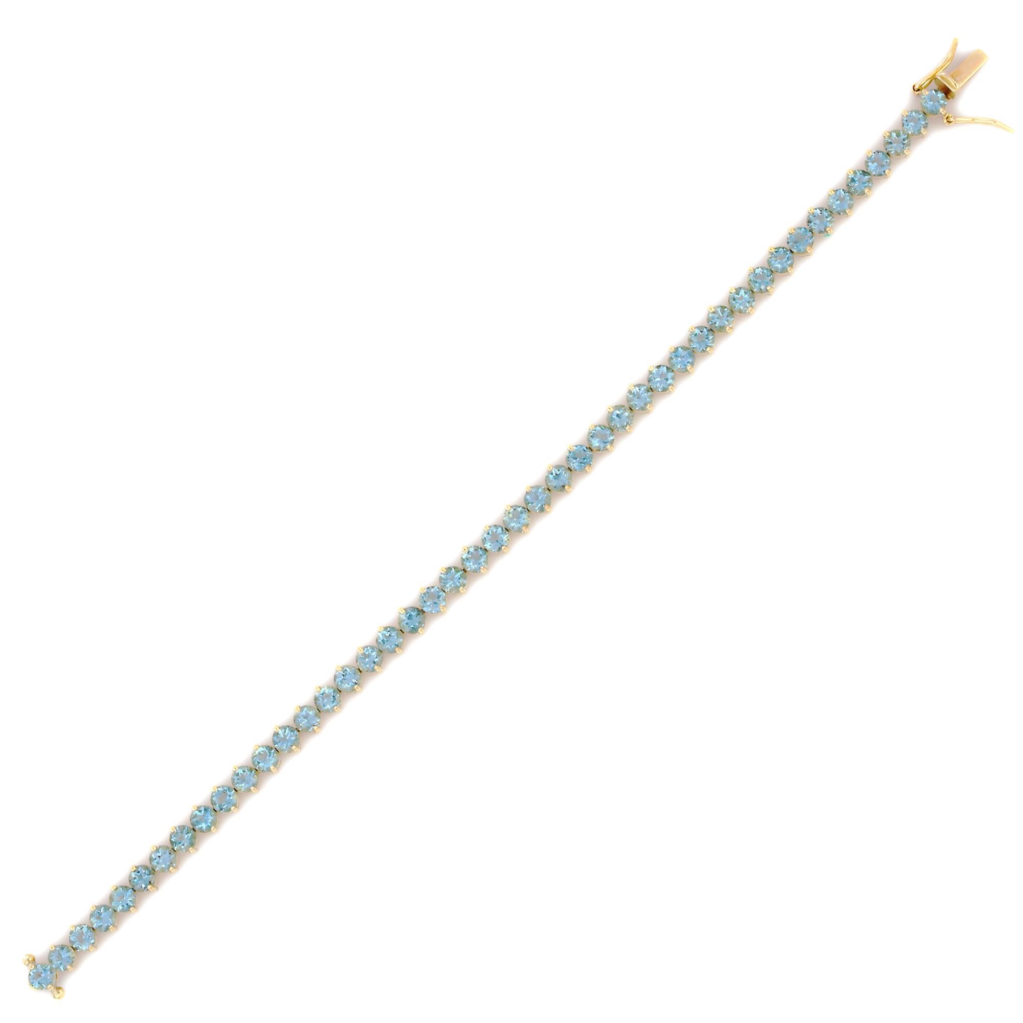 Aquamarine bracelet in 18K Gold. It has a perfect round cut gemstone to make you stand out on any occasion or an event. 
A tennis bracelet is an essential piece of jewelry when it comes to your wedding day. The sleek and elegant style complements