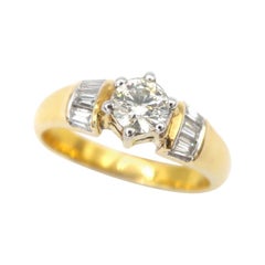 Brilliant Round Diamond 18 Karat Gold Wedding Ring flanked with Baguette Diamond