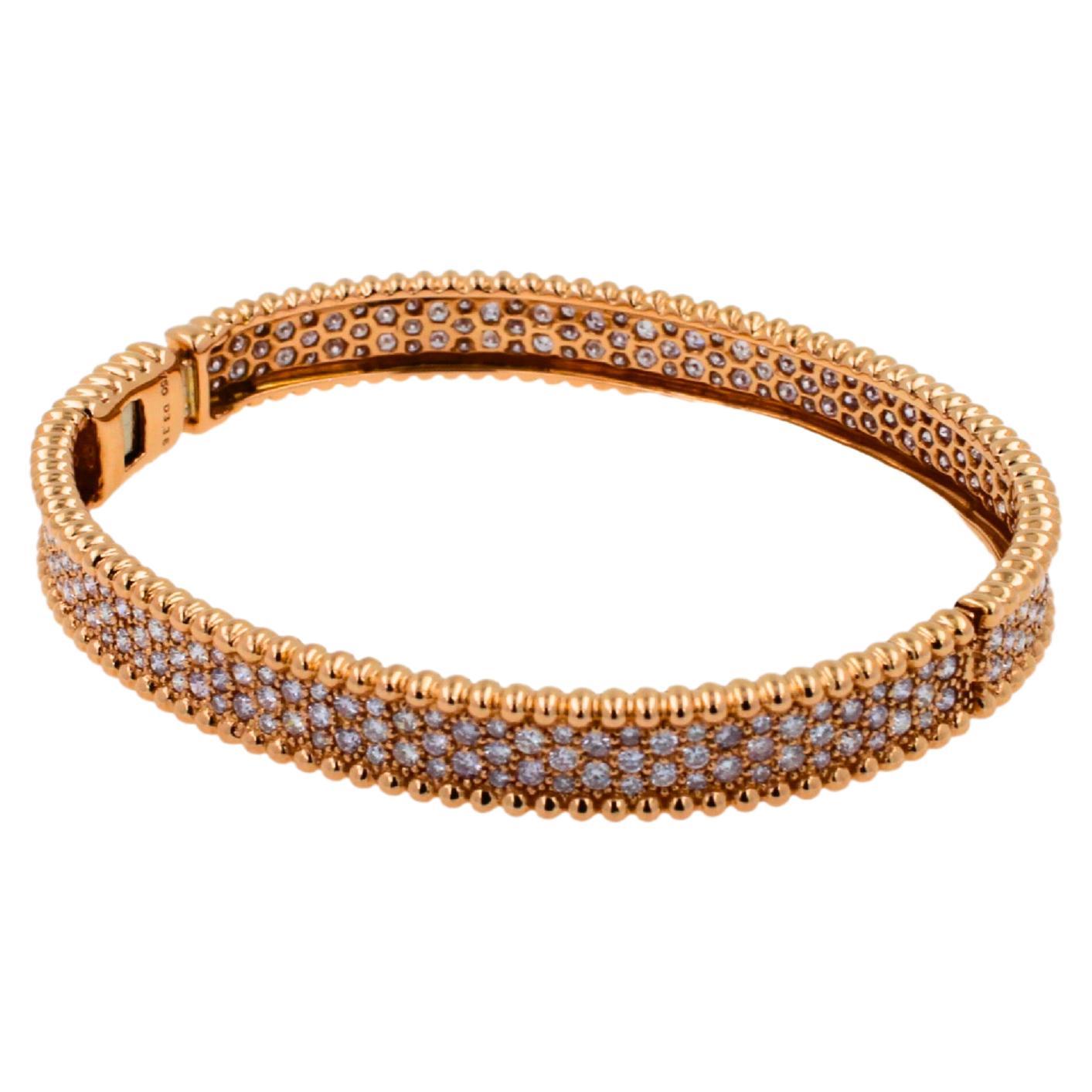 18K Rose Gold
3.36 ctw Diamond Weight
Diamond Quality E/VS1 
Solid Rose Gold Bangle with Hinge + Button Clasp/Closure Mechanism 
French Pave-Style Setting 
Honey Comb Pattern
Size - Inner Circumference: 7.5 Inches
Inner Oval Shape Dimensions: Length