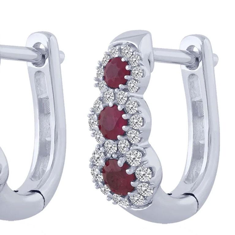 Earrings in 18ct white gold with rubies
Rubies 0.25
Diamonds: 0.45

These gold earrings with diamonds and rubies are part of the Bon Ton collection; classic jewelry with diamonds, rubies and natural sapphires destined for an audience of all ages