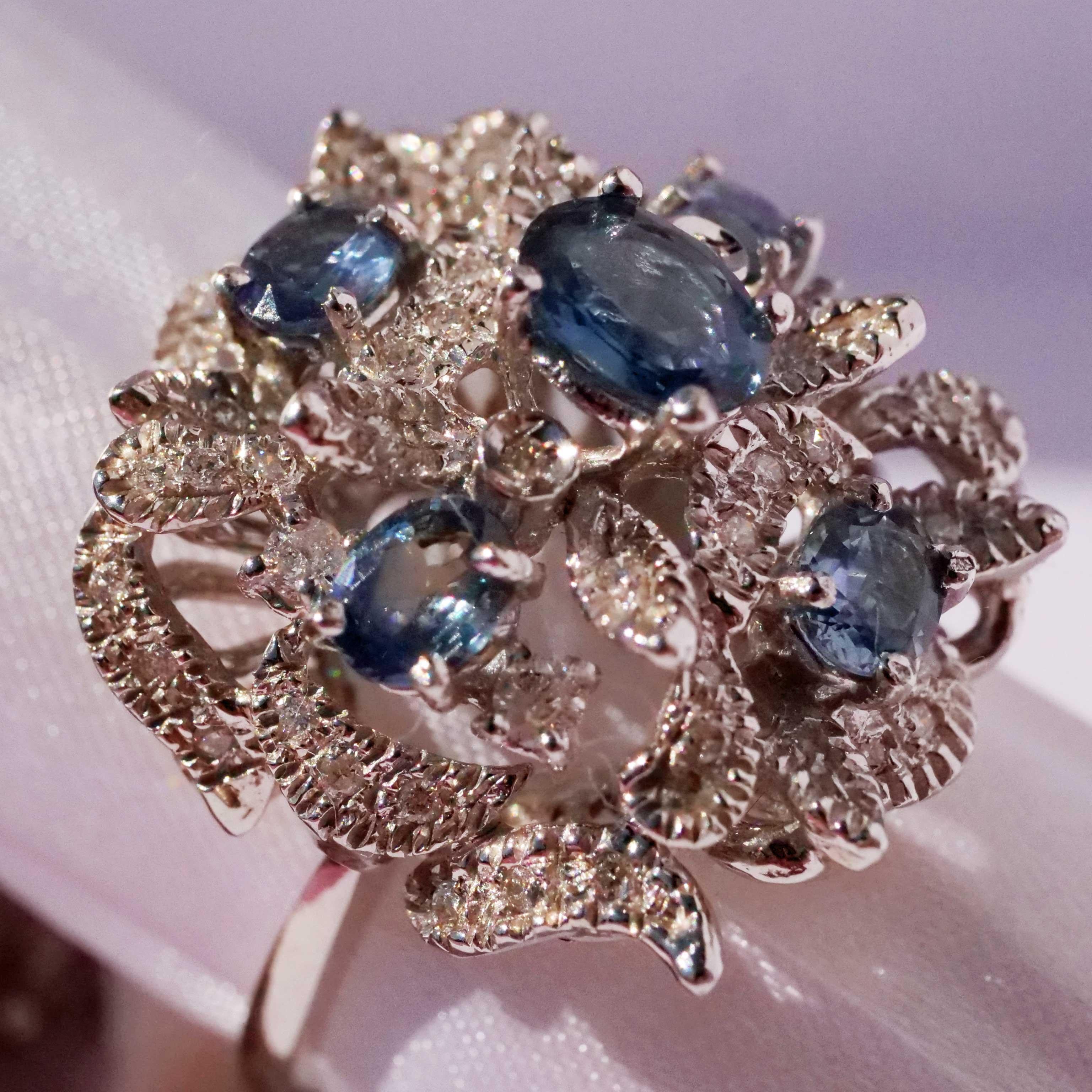 Italian way of life a representative sapphire diamond ring of a special kind, looks beautiful on the hand, countless diamonds and full-cut brilliants set in the smallest corners of the surface, total approx. 0.60 ct, W (white) / SI-P1 (small- clear