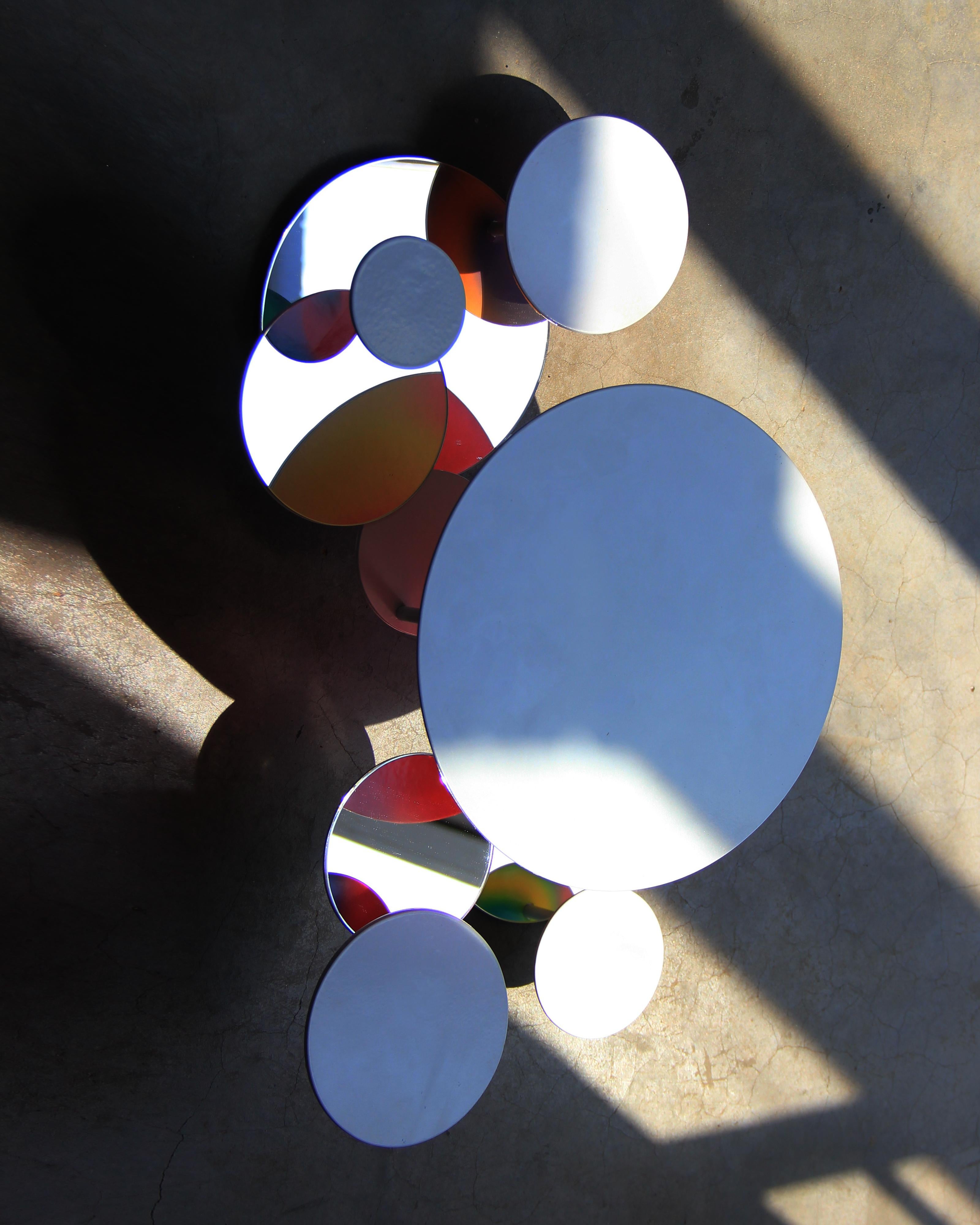 “Brilliant Self”,it presents itself as a colorful embodiment of a world and self full of diversity.

The project use some mirrors reveals the patterned reverse side of the metal plate，and which have  many mirrors and white metal plates coated in