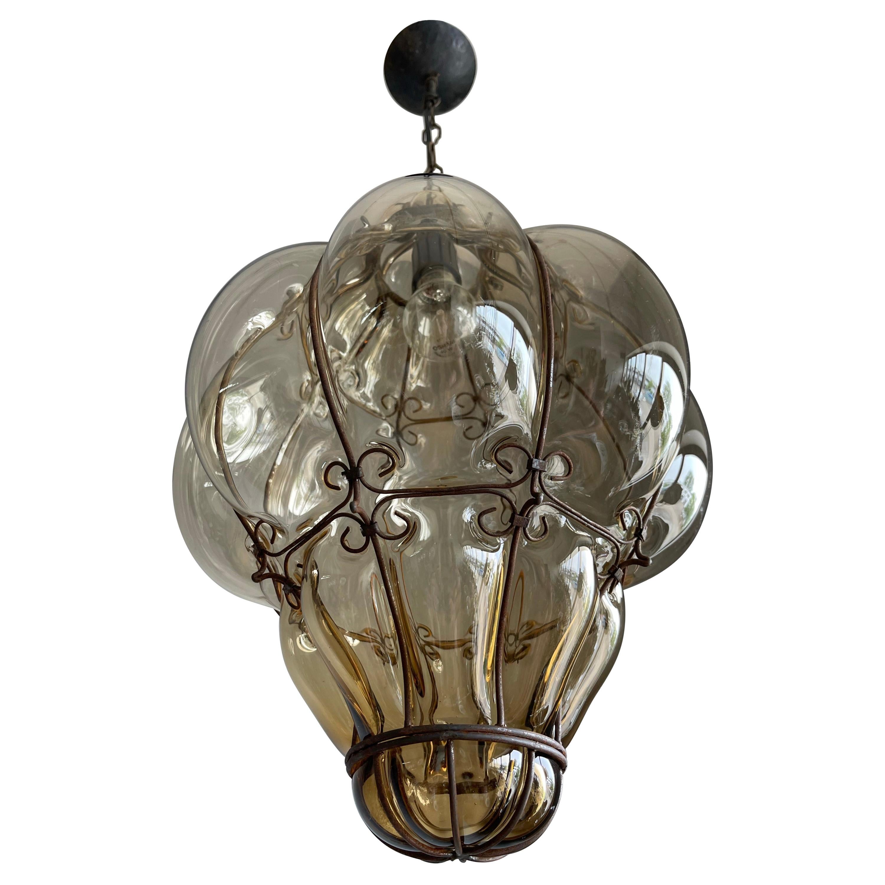 Beautiful color and large size antique Italian fixture with mouth blown glass in a threaded metal frame. 

If you are looking for a rare and stylish shape fixture to grace your home then this handmade antique specimen could be flying your way soon.