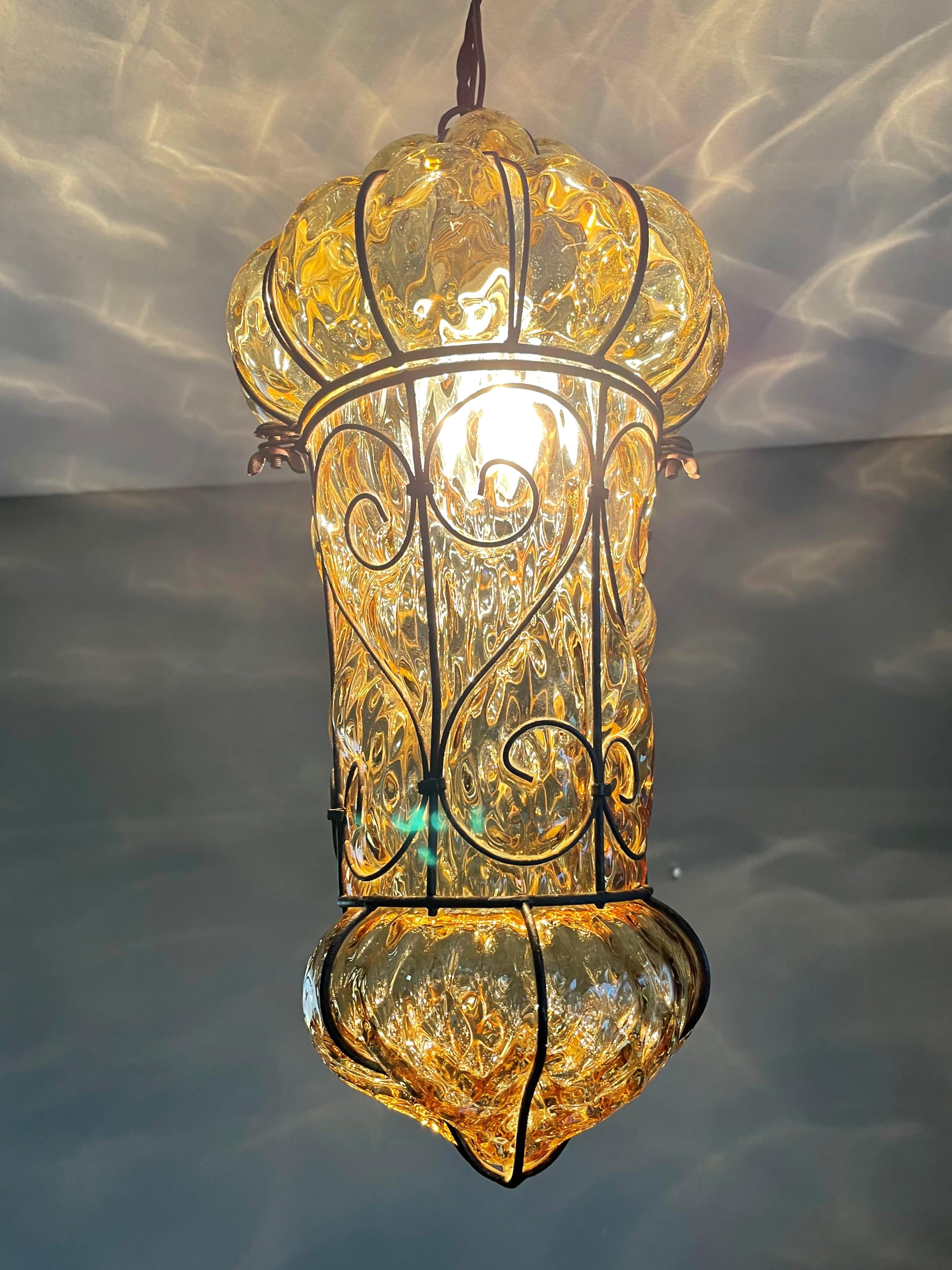 Beautiful color and practical size Italian fixture with mouth blown art glass in a metal frame. 

If you are looking for a rare and stylish shape fixture to grace your home then this handmade, near-antique specimen could be yours to enjoy soon. With