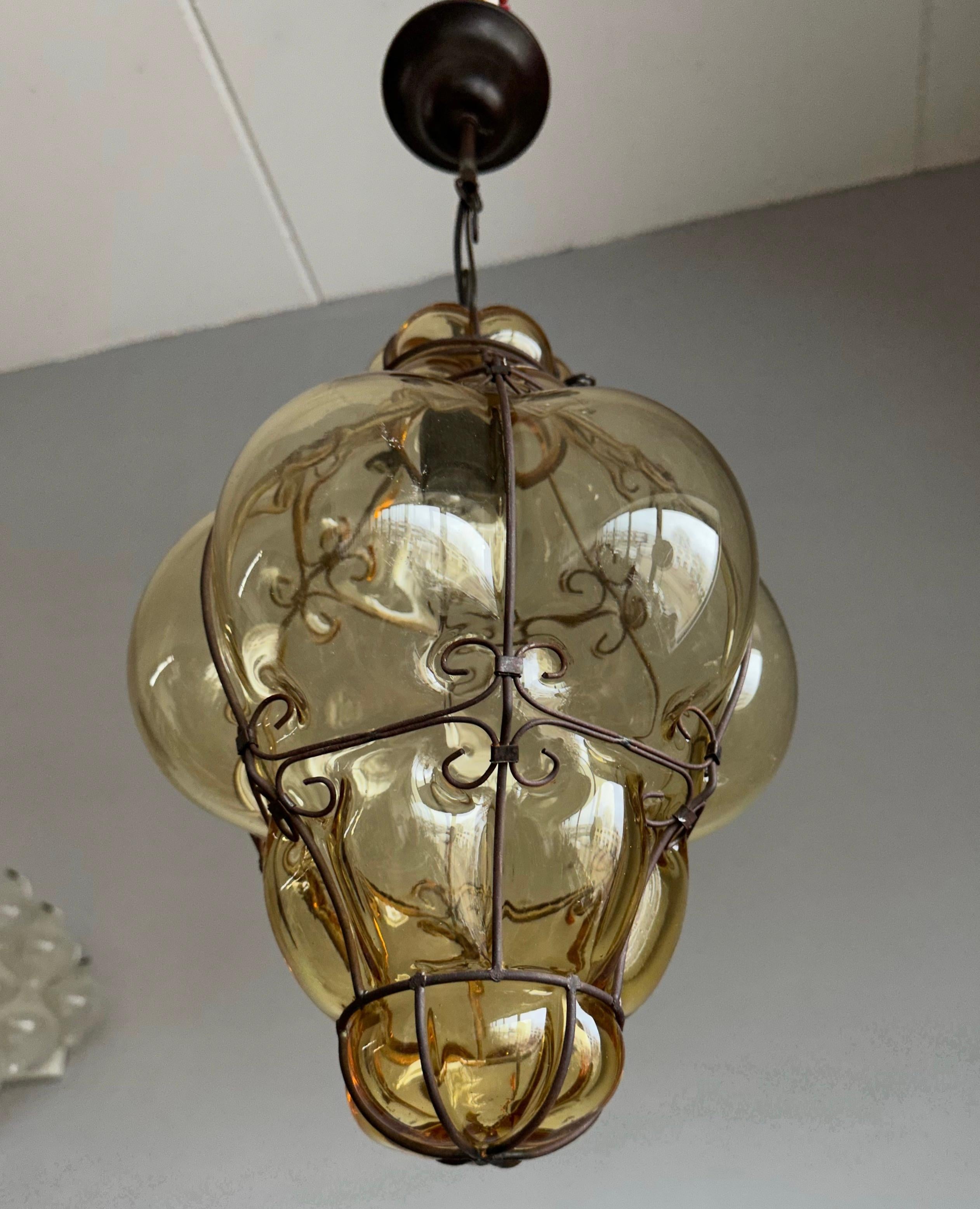 Beautiful color and good size vintage Italian murano fixture with mouthblown glass in a blackened thread metal frame. 

If you are looking for a stylish design, near-antique light to grace your home then this handmade specimen from the 1930s could