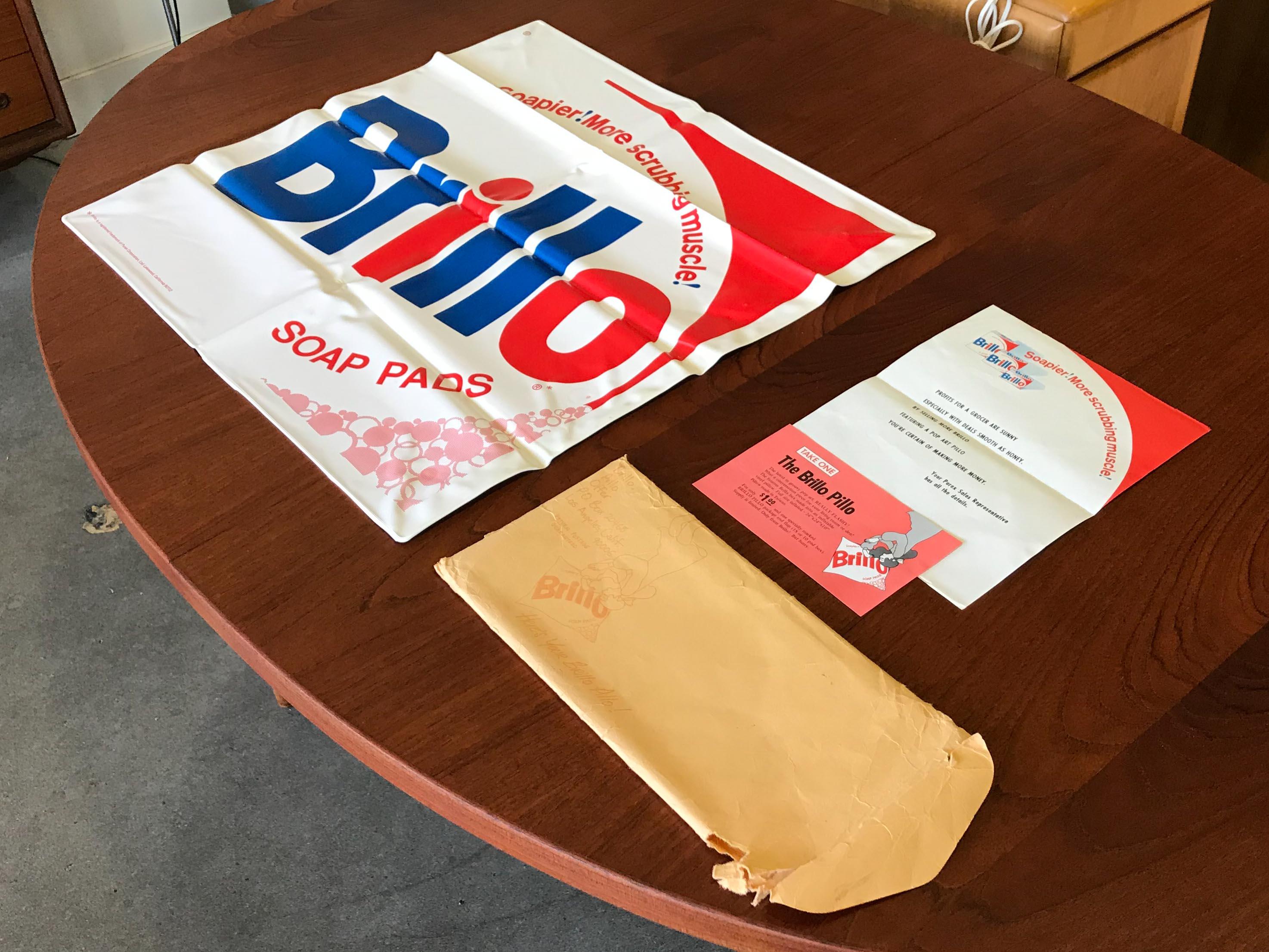 Brillo Pillow promotional advertising for Brillo Pads Purex Corporation from late 1960s.  This graphic design inspired Andy Warhol's famed Brillo sculptures.

Includes original documentation from the Brillo Corporation and mailing envelope stamped