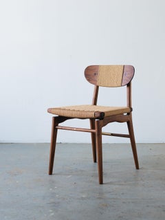 Brine Chair by Common Species. In walnut with Danish cord woven seat.