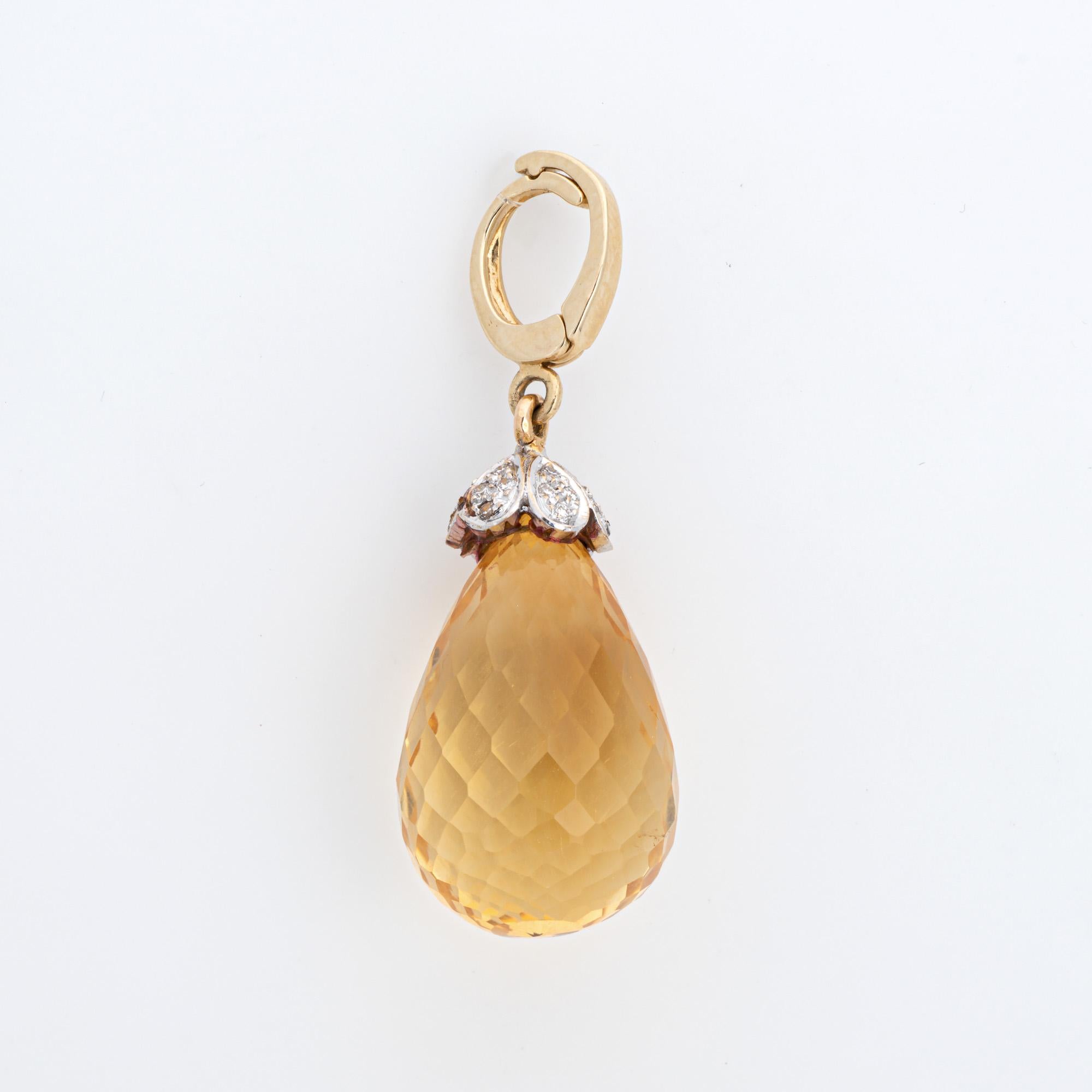 Finely detailed briolette diamond pendant crafted in 14k yellow gold (circa 1960s).  

Briolette citrine measures 23mm x 13.5mm. Diamonds total an estimated 0.14 carats (estimated at I-J color and SI1-I1 clarity). The citrine is in very good