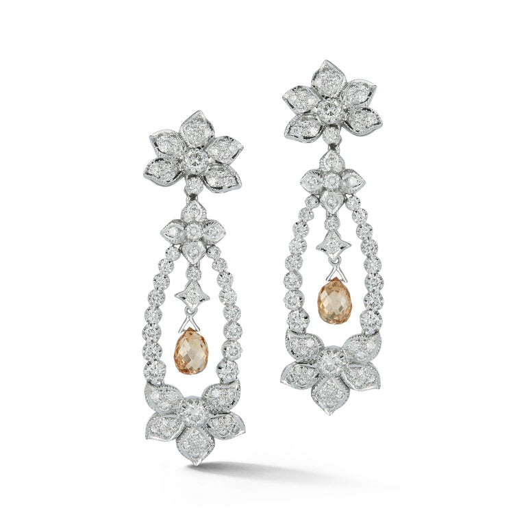Briolette Diamond Flower Chandelier Earrings

Set with two fancy champagne colored briolete diamonds

Back Type: Clip on with post

Gold Type: 18K White Gold

Measurements: 2