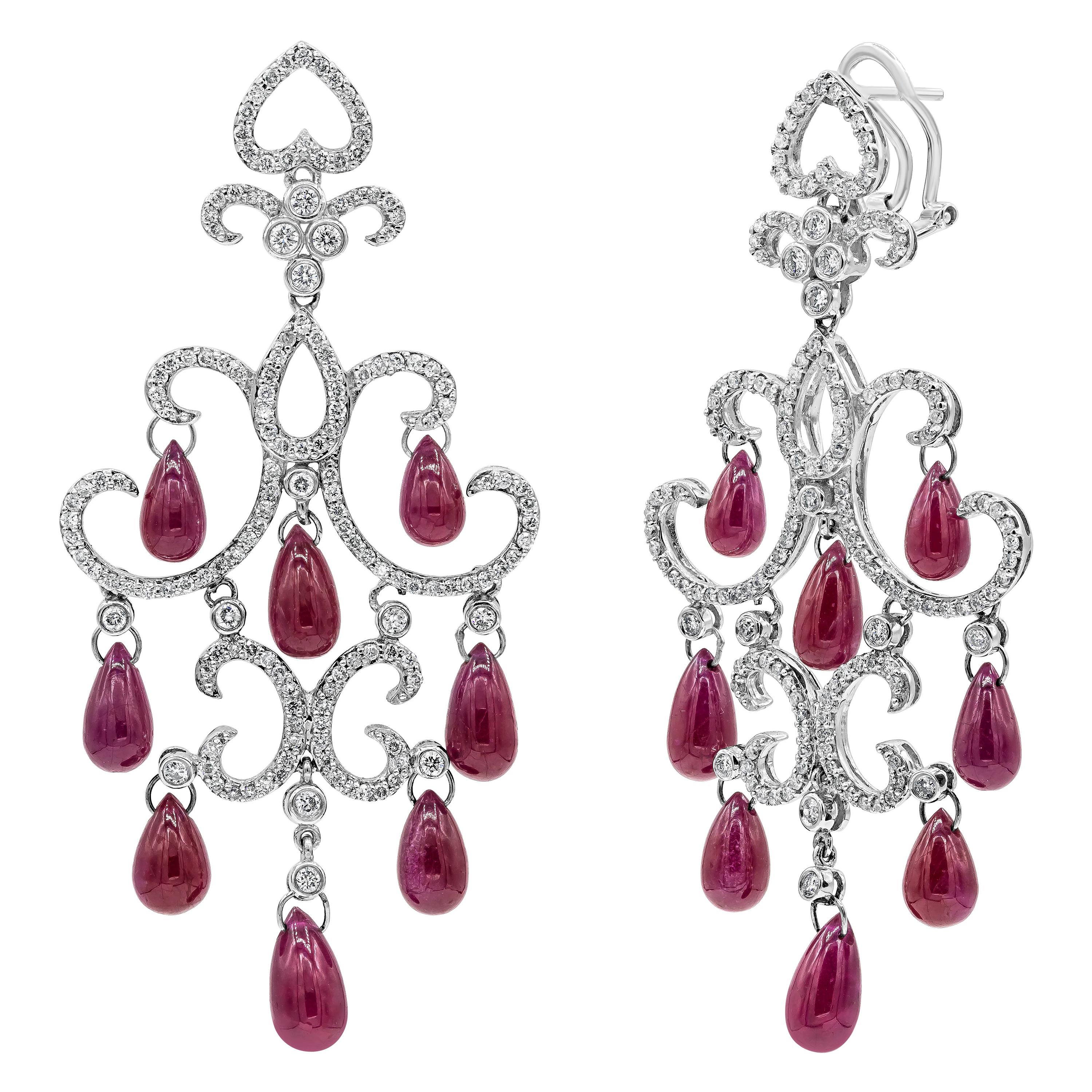 An intricately designed piece of chandelier earrings showcasing 16 color-rich dangling briolette rubies weighing 32.20 carats total. Accented with 328 brilliant round diamonds weighing 1.90 carats total in a chandelier design. Perfectly made in 18K