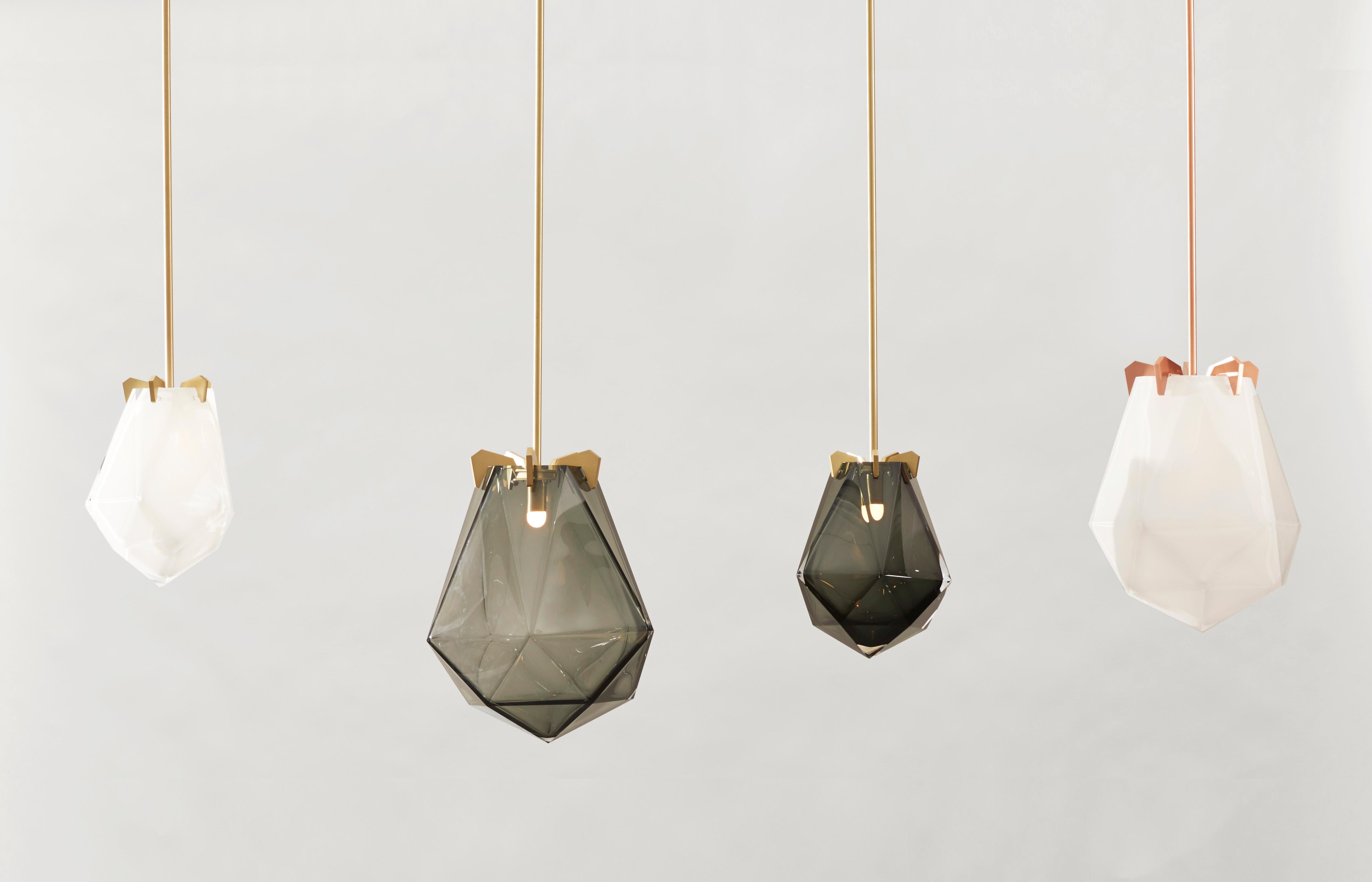 Named for its sharp edges and various facets, the Briolette pendant is available in pendant and flush-mount application. The supporting prongs and signature double-blown glass are available in various tones and finishes.