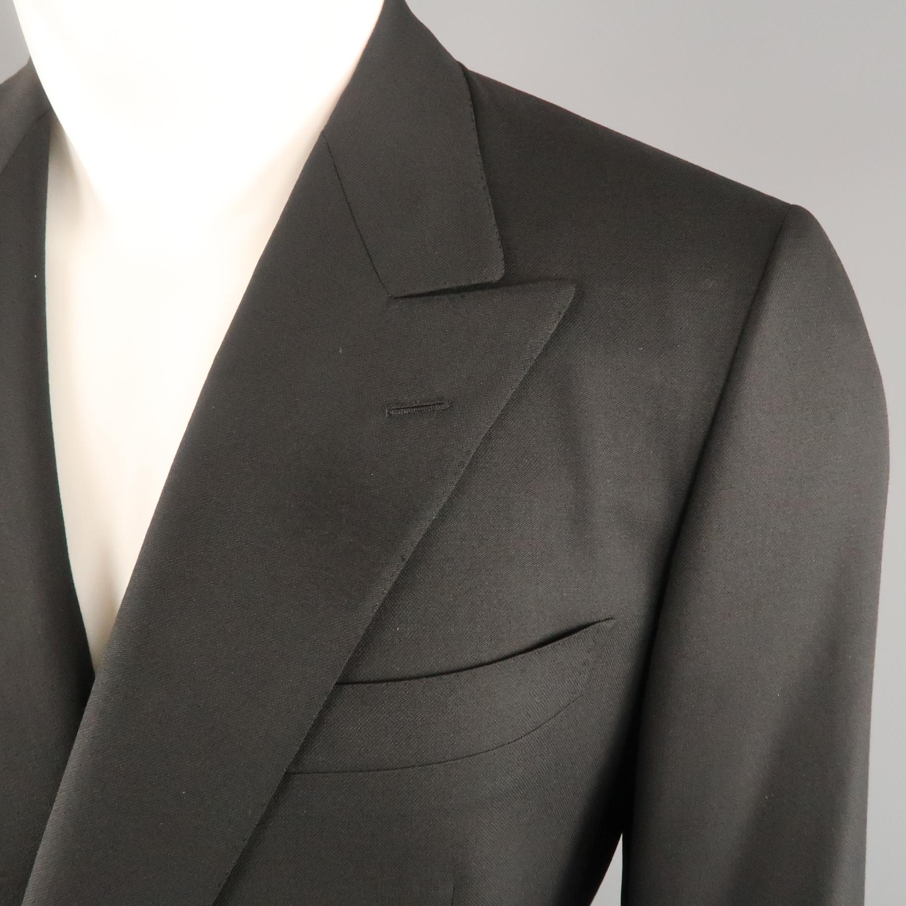 Vintage BRIONI sport coat comes in Black wool with a peak lapel, double breasted,  gold tone metal button front, and flap pockets. Wear on lapel. As-is. Made in Italy.
 
Good Pre-Owned Condition.
Marked: IT 50
 
Measurements:
 
Shoulder: 17