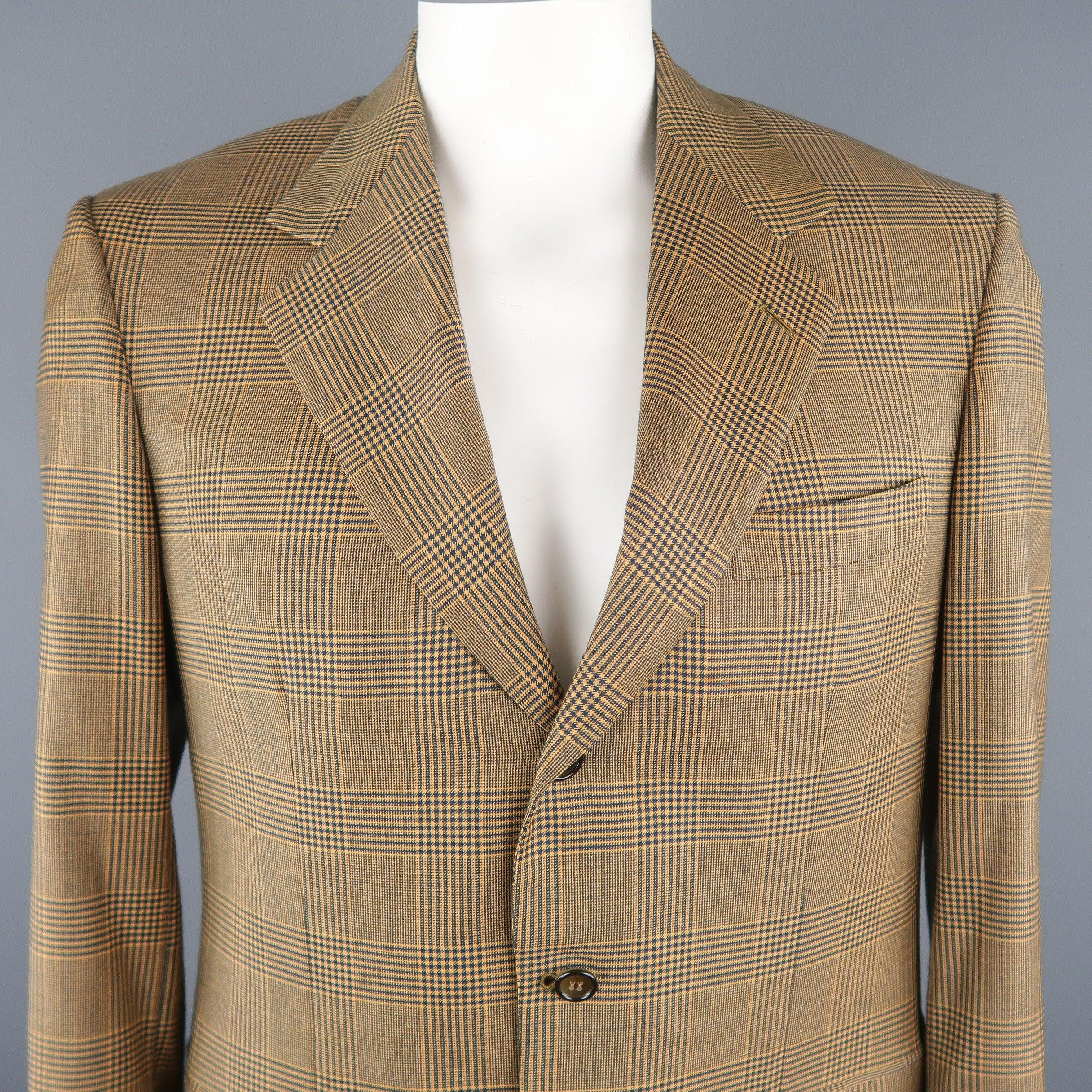 BRIONI blazer comes in gold and navy tones in a plaid wool material, featuring a notch lapel, slit and flap pockets, 3 buttons closure, single breasted. Light spot at front. 
Made in Italy. 
Good Pre-Owned Condition. 

Marked:   50 IT