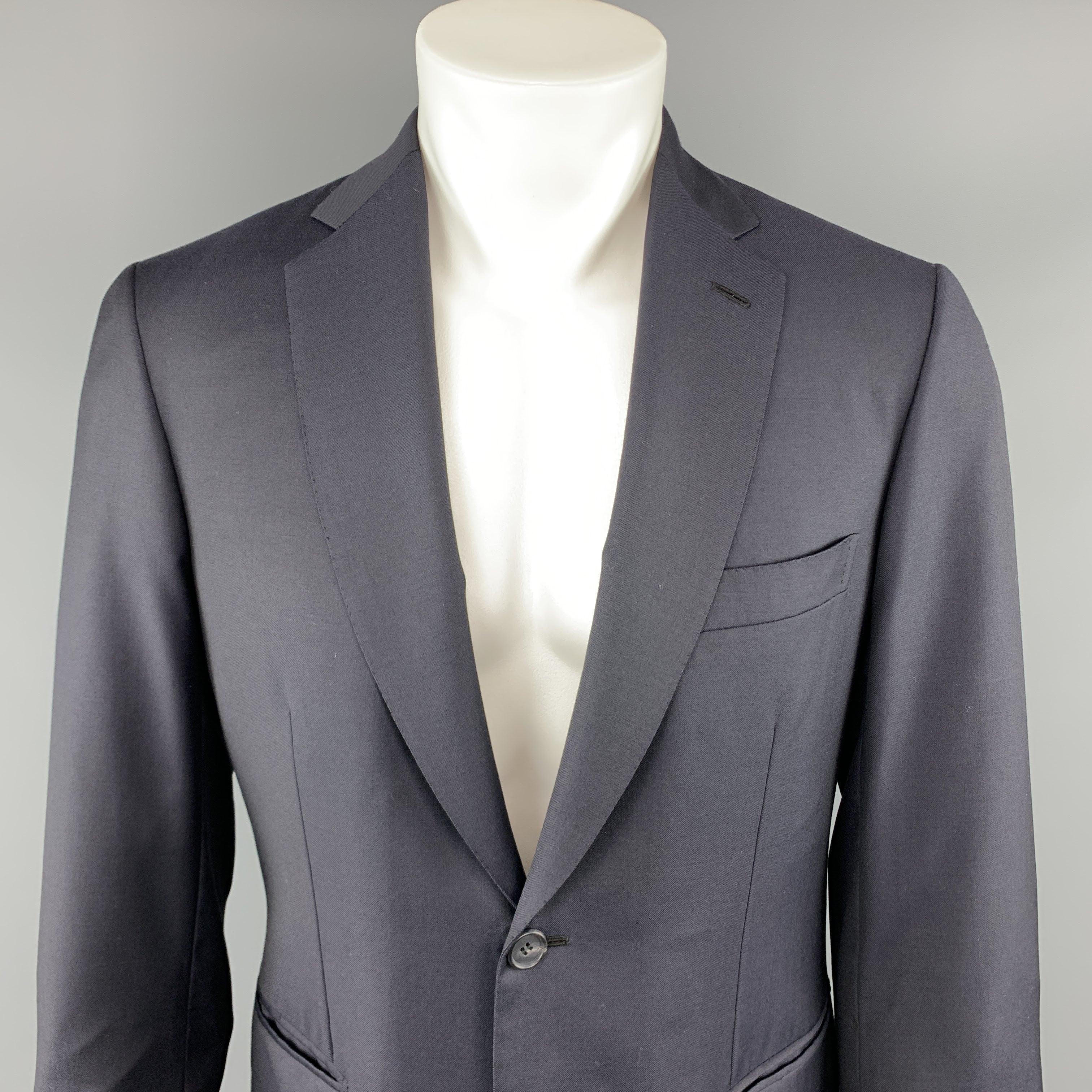BRIONI by WILKES BASHFORD sport coat comes in a navy wool featuring a notch lapel style, flap pockets, and a two button closure. 
Excellent Pre-Owned Condition.
 

Marked:   (No size)
 

Measurements: 
  
lShoulder: 18 inches  
lChest: 38 inches 