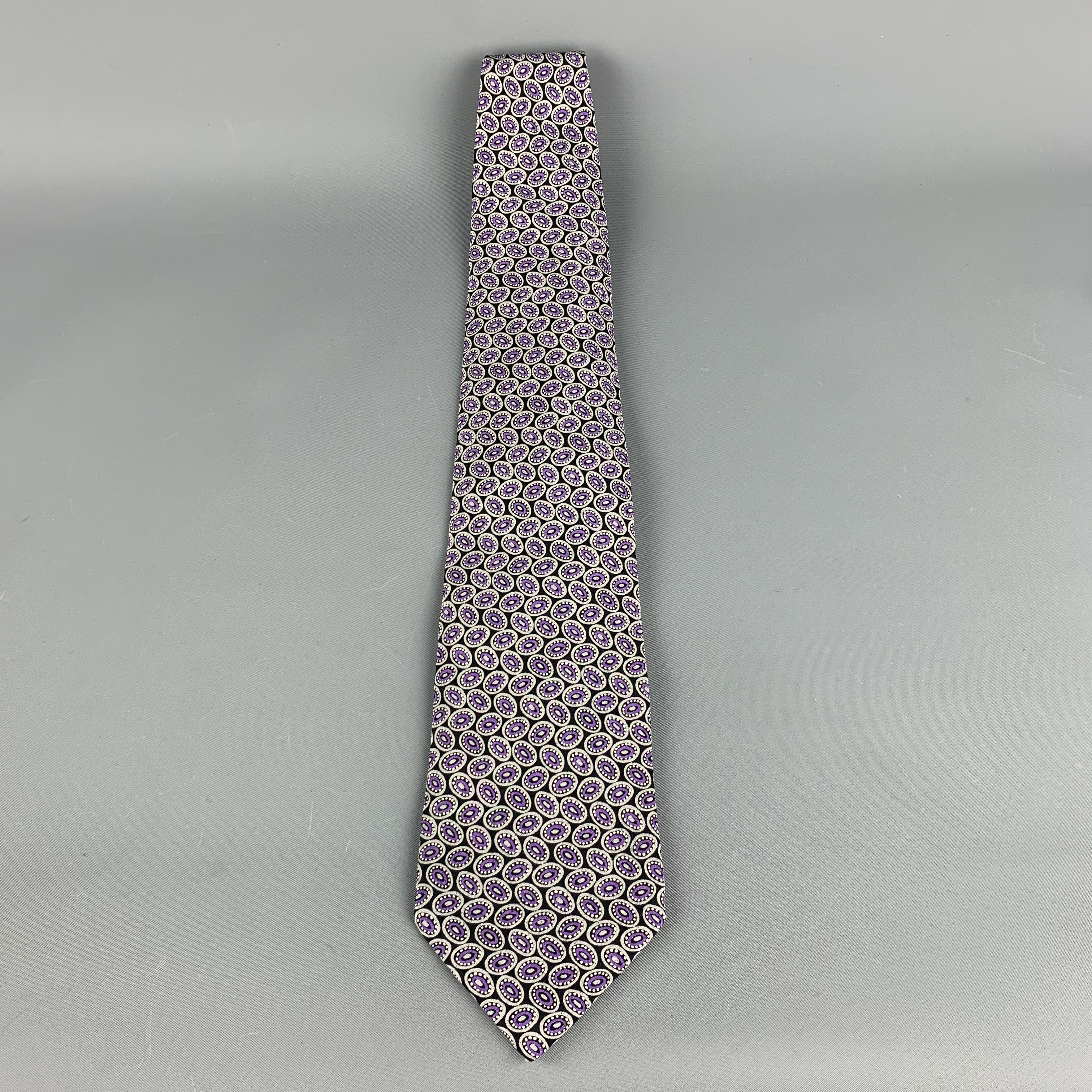 BRIONI Tie comes in black and purple tones in a silk material, with all over dots print and a gold metal tone hardware. Handmade. Made in Italy.
 
Excellent Pre-Owned Condition.
 
Width : 4 in
