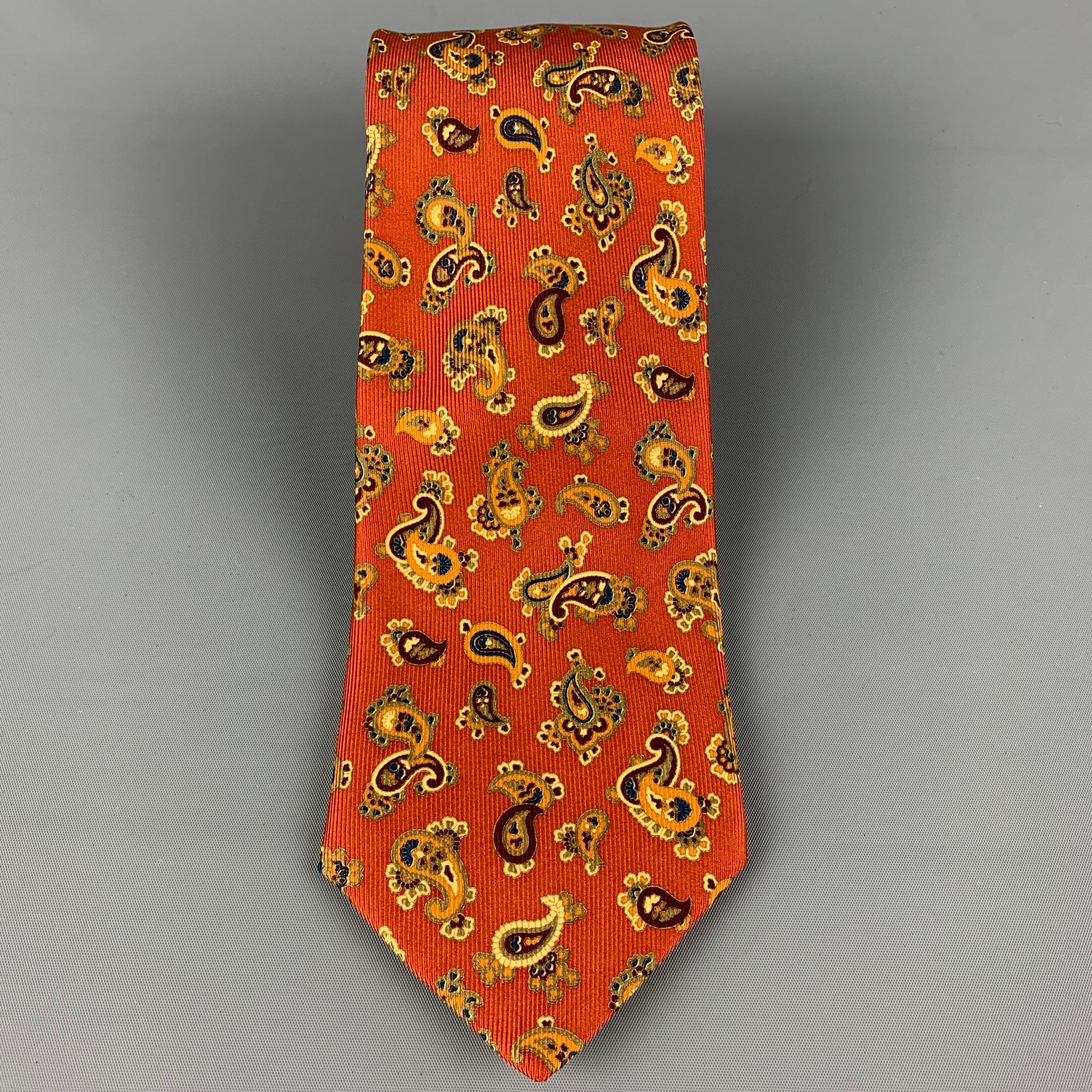 BRIONI necktie comes in a brick & tan silk with a all over paisley print. Made in Italy.

Very Good Pre-Owned Condition.
Original Retail Price: $330.00

Width: 3.75 in.
Length: 62 in. 