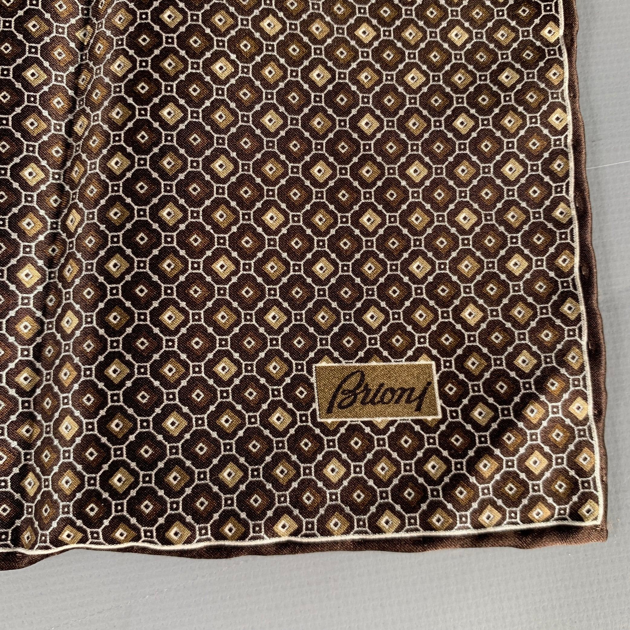 BRIONI pocket square
in a brown and taupe silk fabric featuring an abstract floral design and luxurious hand rolled edges. Made in Italy. New with Tags. 

Measurements: 
  14.5 inches  x 14.5 inches 
  
  
 
Sui Generis Reference: 130930
Category: