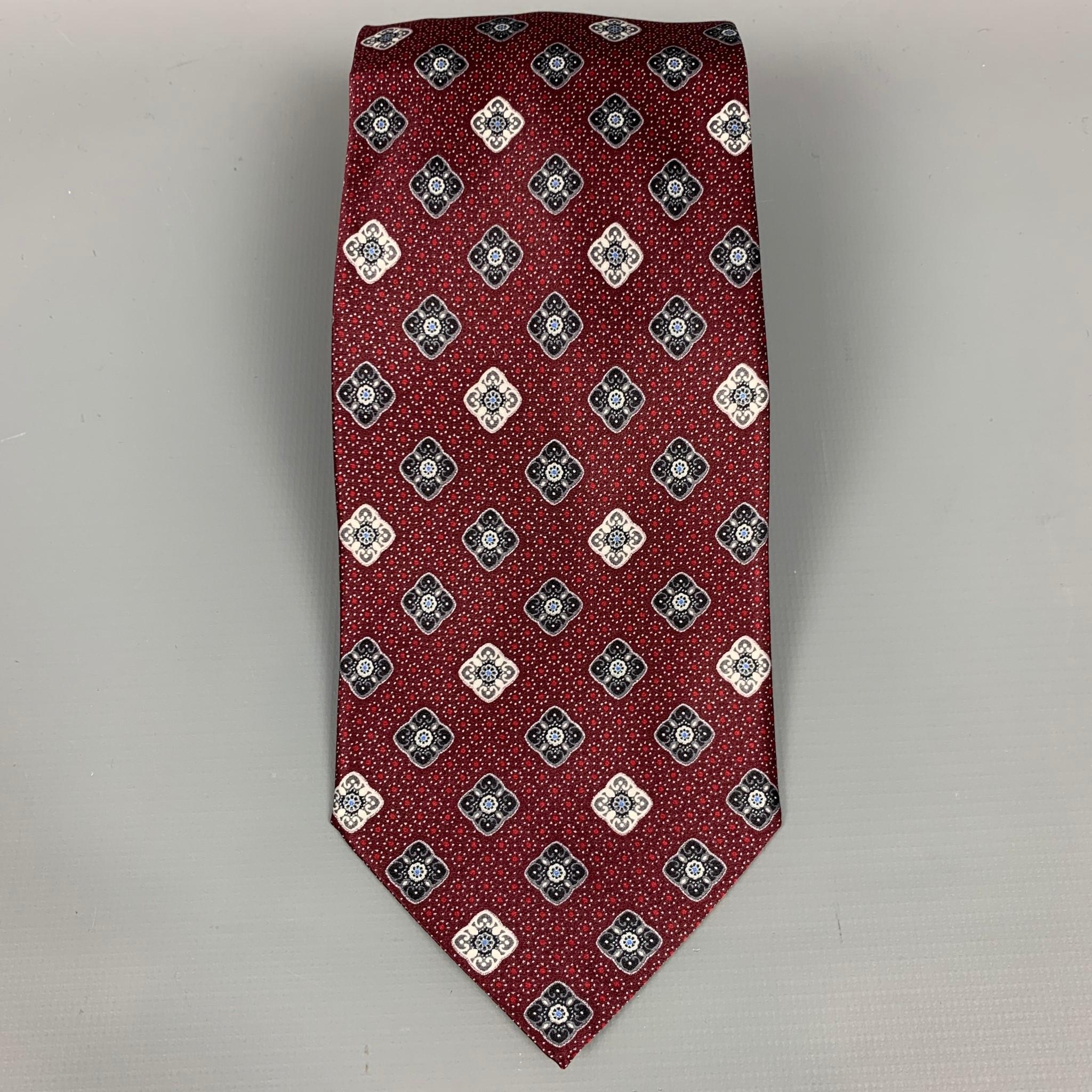 BRIONI neck tie comes in a burgundy & silver print silk. Made in Italy.

Very Good Pre-Owned Condition.

Measurements:

Width: 3.5 in.  