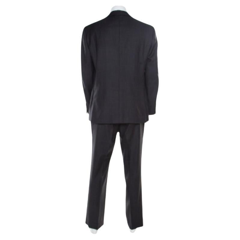 Nothing gives you a better style than a well-tailored suit. This one from the house of Brioni, flaunting a herringbone pattern all over, is a classic creation meant to elevate your formal look. Cut from natural wool, the blazer features a notched