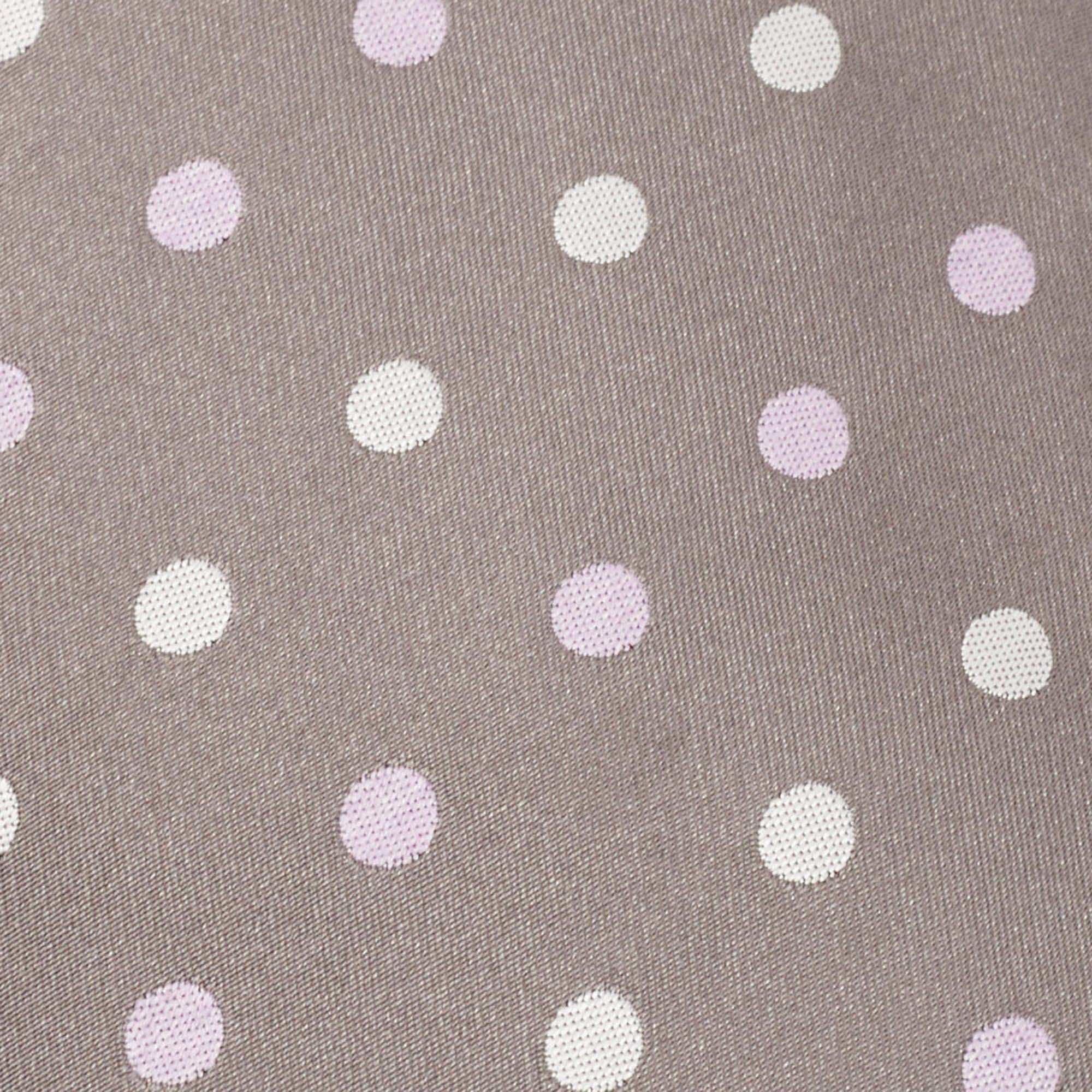Made in Italy using 100% silk this Brioni grey tie for men has polka dots all over. This finely tailored accessory will add a charming finish.
