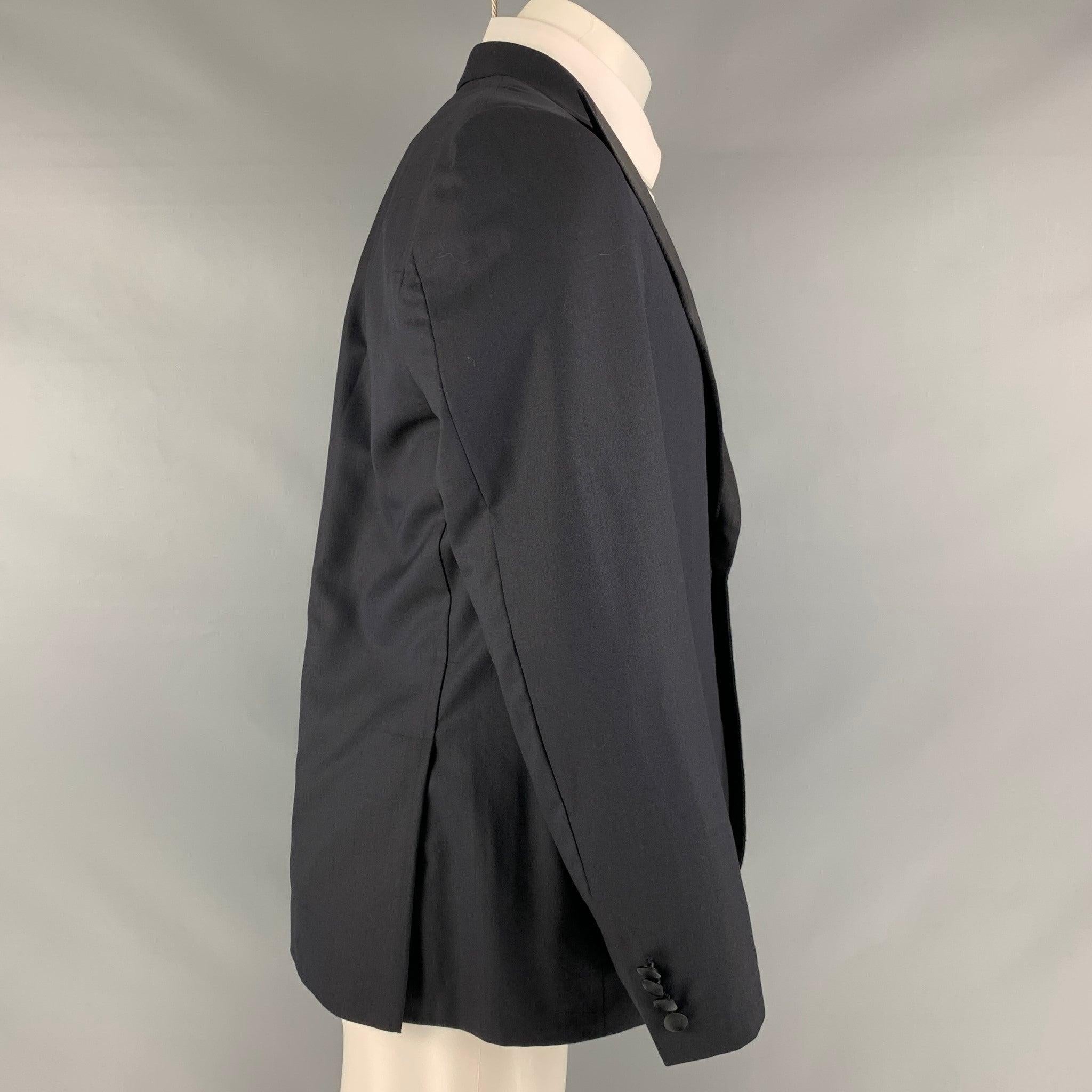 BRIONI sport coat comes in a black and navy wool woven material featuring a peak lapel, welt pockets, double back vent, and a single button closure. Made in Italy.Excellent Pre-Owned Condition. 

Marked:   40 

Measurements: 
 
Shoulder: 17.5 inches