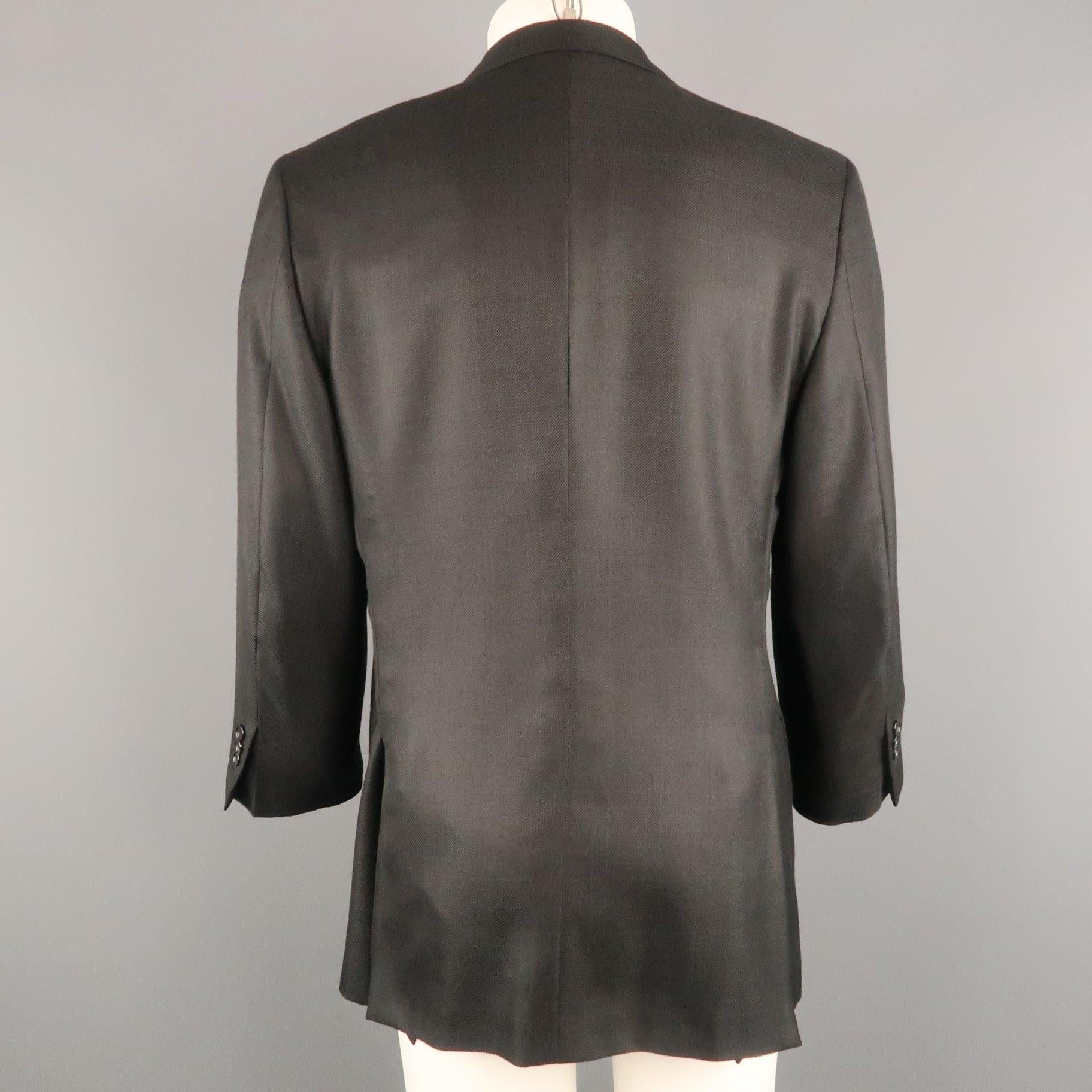Vintage BRIONI sport coat comes in wool silk blend windowpane fabric with a notch lapel, single breasted, three button front, and functional button cuffs. Made in Italy.Good Pre-Owned Condition.  

Marked:   IT 52 

Measurements: 
 
Shoulder: 18