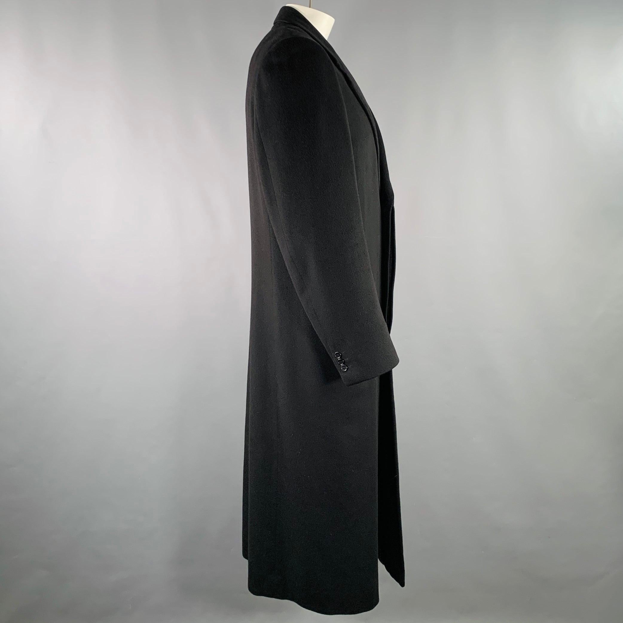 BRIONI for WILKES BASHFORD coat
in a black cashmere featuring a single breasted style with hidden button closure. Made in Italy.Excellent Pre-Owned Condition. 

Marked:   44 

Measurements: 
 
Shoulder: 18.5 inches  Chest: 46 inches  Sleeve: 26.5