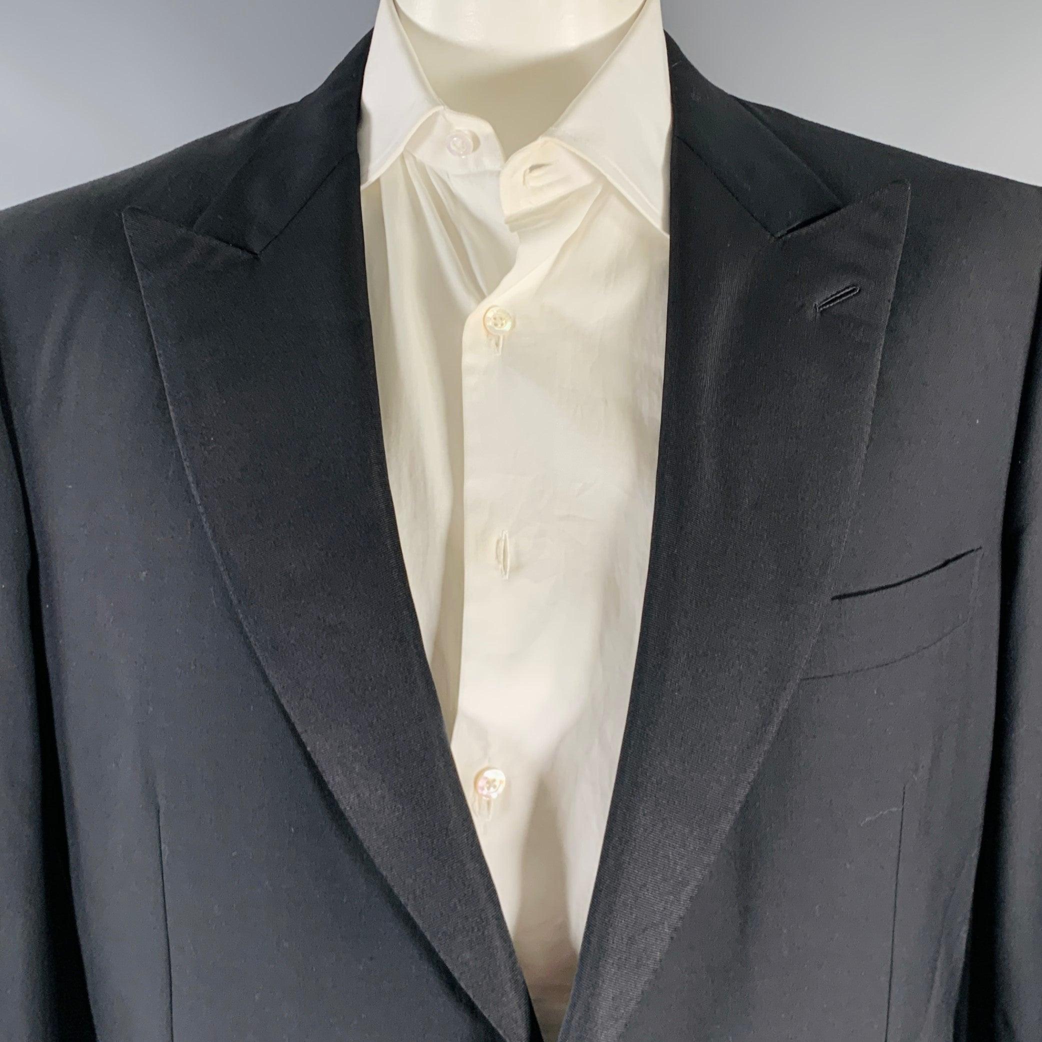 BRIONI tuxedo sport coat
in a black wool fabric featuring peak lapel, double vented back, and single button closure. Made in Italy.Excellent Pre-Owned Condition. 

Marked:   46 L 

Measurements: 
 
Shoulder: 19 inches Chest: 46 inches Sleeve: 26