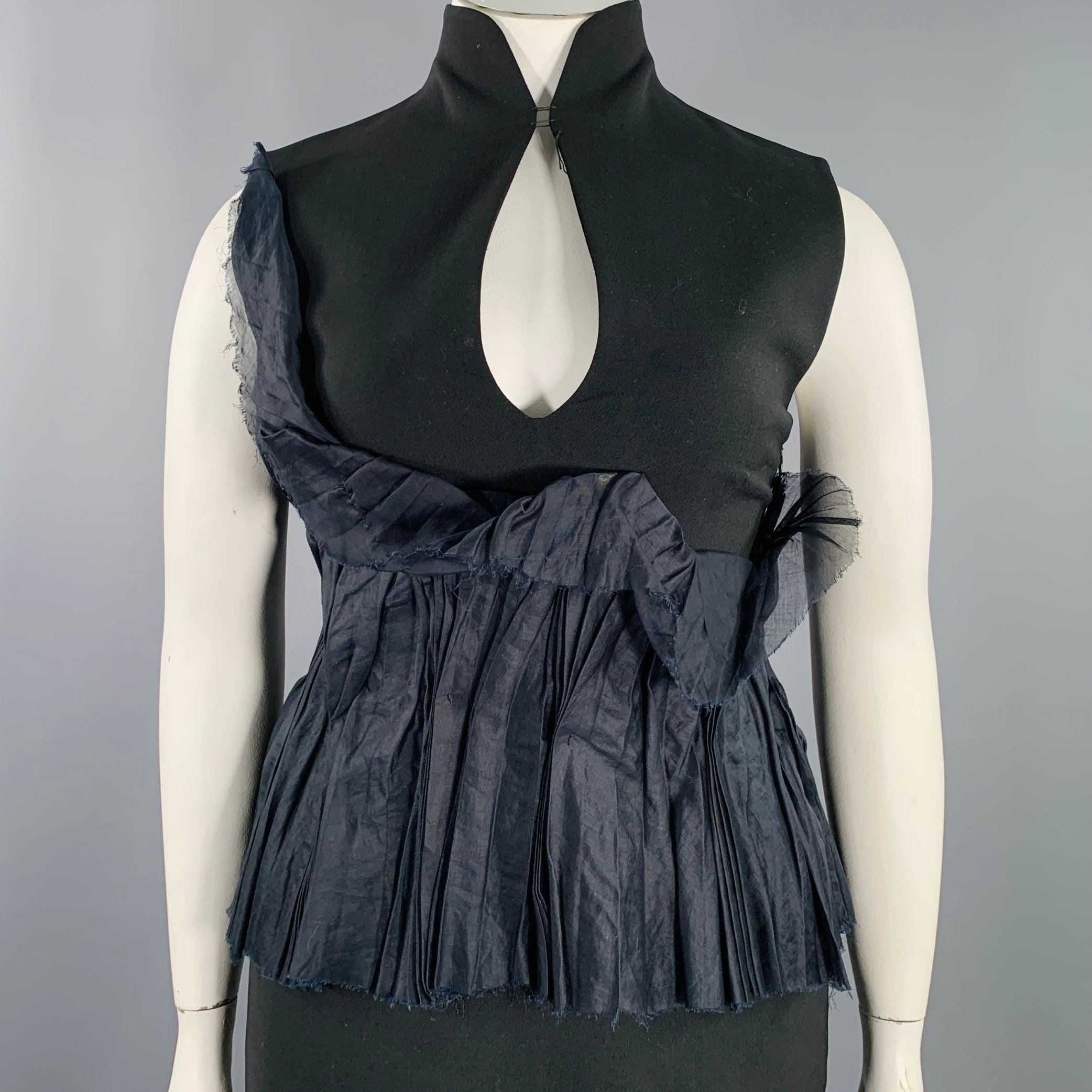 BRIONI dress in a black mercerized cotton featuring a high collar, ruffled panel design, sleeveless, open back, side zipper, and a hook & loop closure.Very Good Pre-Owned Condition. Minor marks and signs of wear. 

Marked:   Fabric tag faded.