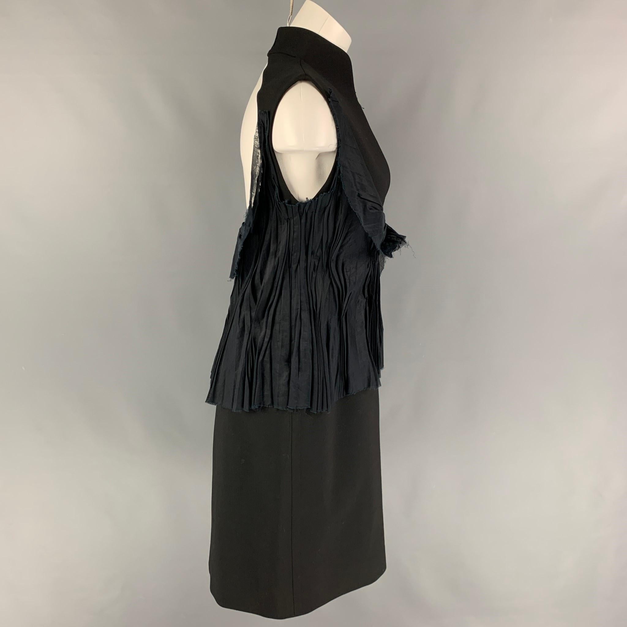 BRIONI dress comes in a black mercerized cotton featuring a high collar, ruffled panel design, sleeveless, open back, side zipper, and a hook & loop closure.

Very Good Pre-Owned Condition. Fabric tag removed.
Marked: Size tag removed.
Original