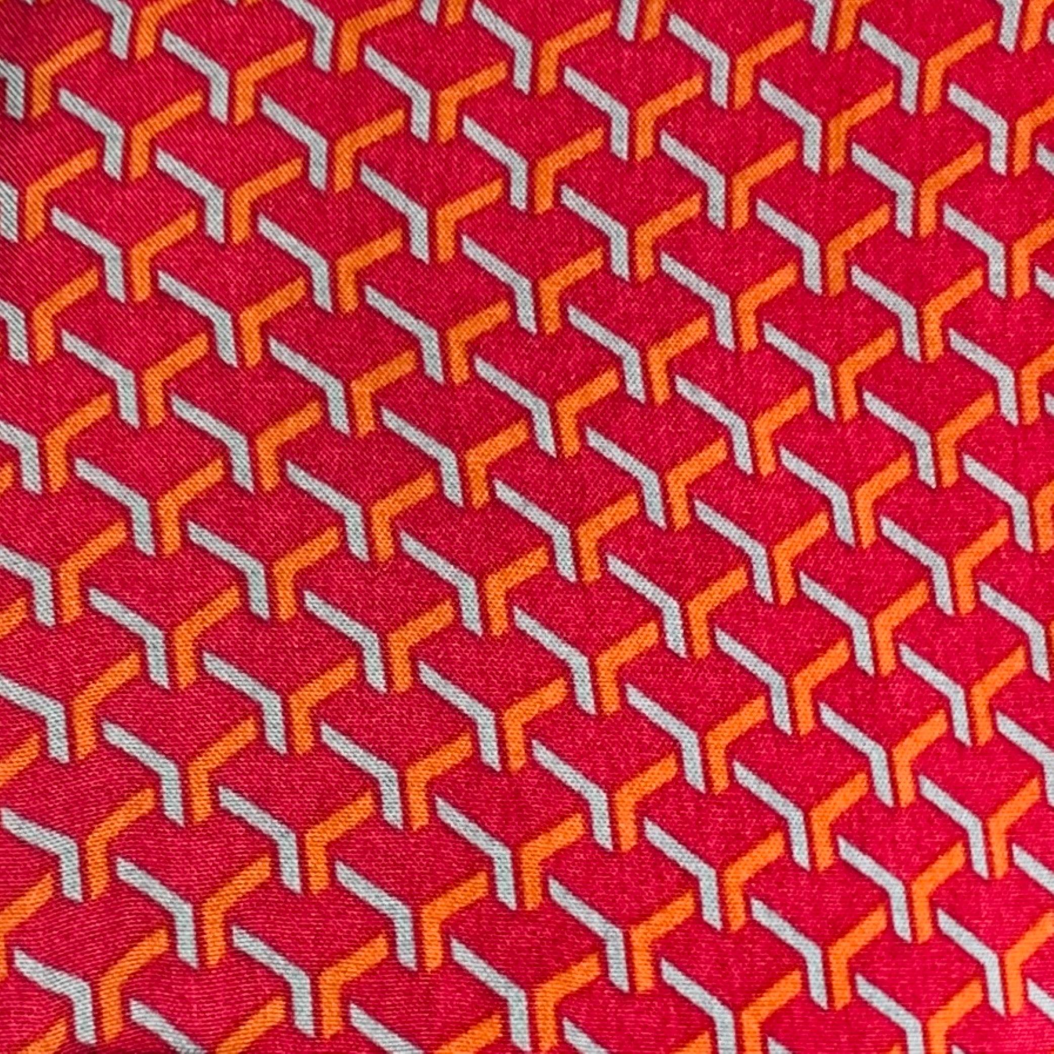 BRIONI for NEIMAN MARCUS short sleeve shirt
in a burgundy, orange, and blue rayon fabric featuring a geometric print, one patch pocket, and button closure. Made in Italy.Excellent Pre-Owned Condition. 

Marked:   L 

Measurements: 
 
Shoulder: 19