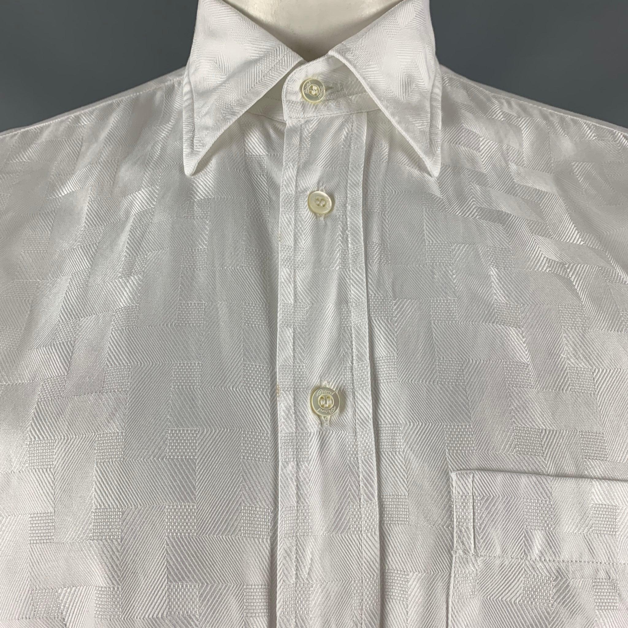 BRIONI long sleeve shirt comes in a white cotton jacquard featuring a button down collar, patch pocket, and a button down closure. Made in Italy.Very Good Pre-Owned Condition.  

Marked:   M 

Measurements: 
 
Shoulder: 19 inches Chest: 47 inches