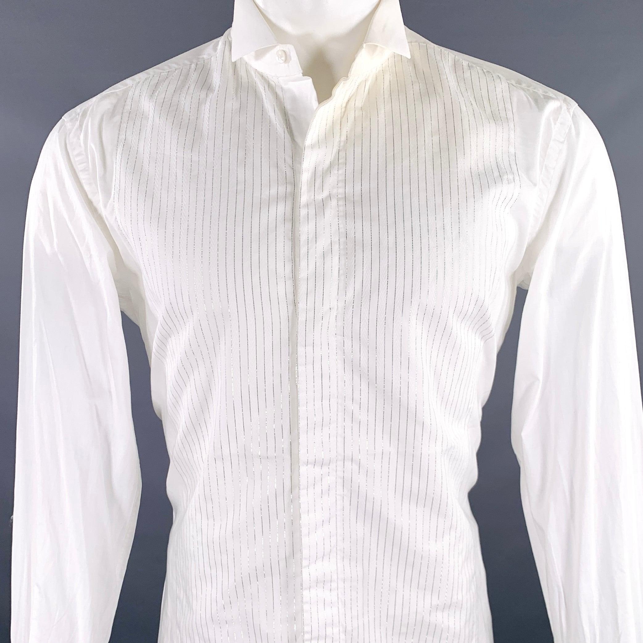BRIONI long sleeve shirt
in a white cotton woven fabric featuring a wingtip collar, metallic silver tone striped front with herringbone patterned details, French cuffs,and hidden button closure. Cufflinks not included. Made in Italy.Very Good