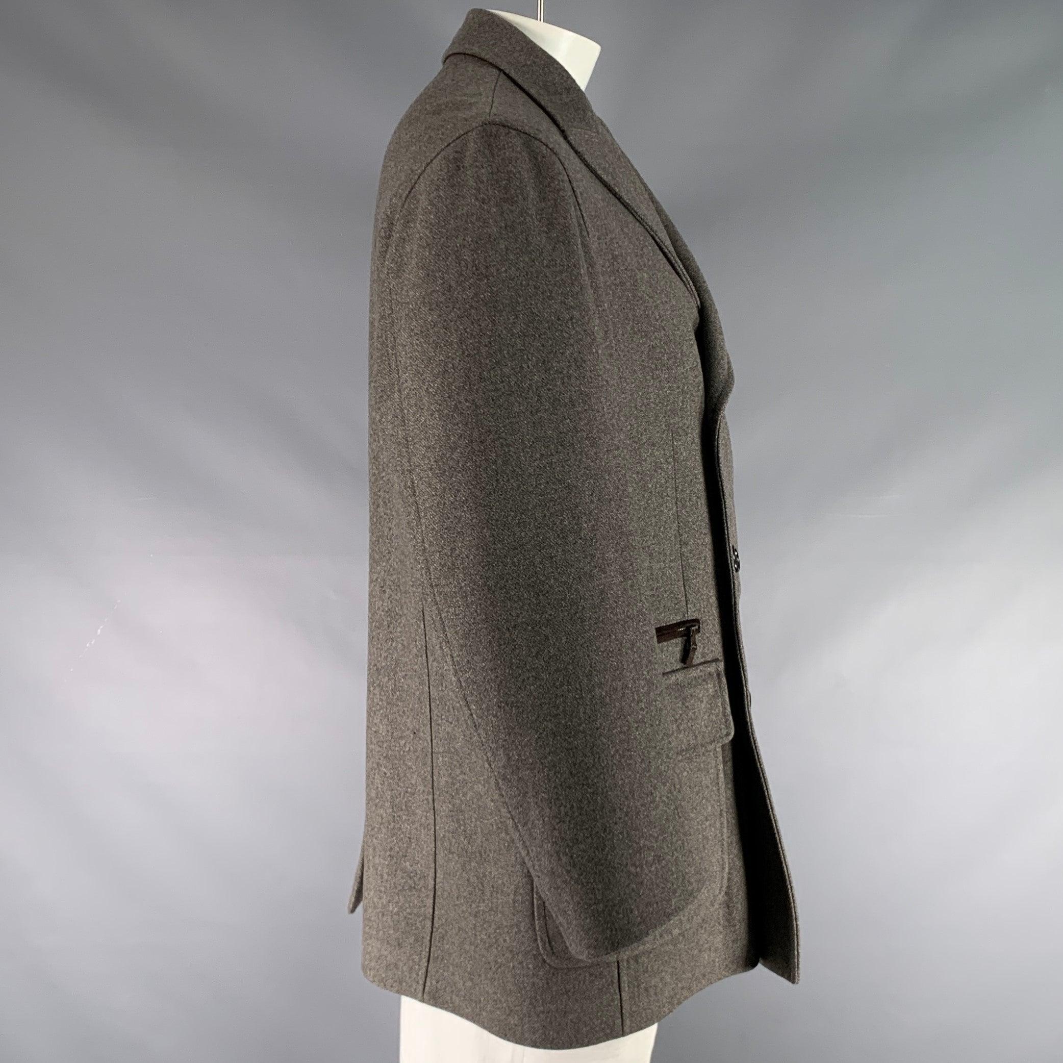 BRIONI coat in a grey wool fabric featuring a double breasted peacoat style, two patch pockets, and button closure. Made in Italy.Excellent Pre-Owned Condition. 

Marked:   XXL 

Measurements: 
 
Shoulder: 20.5 inches Chest: 50 inches Sleeve: 25