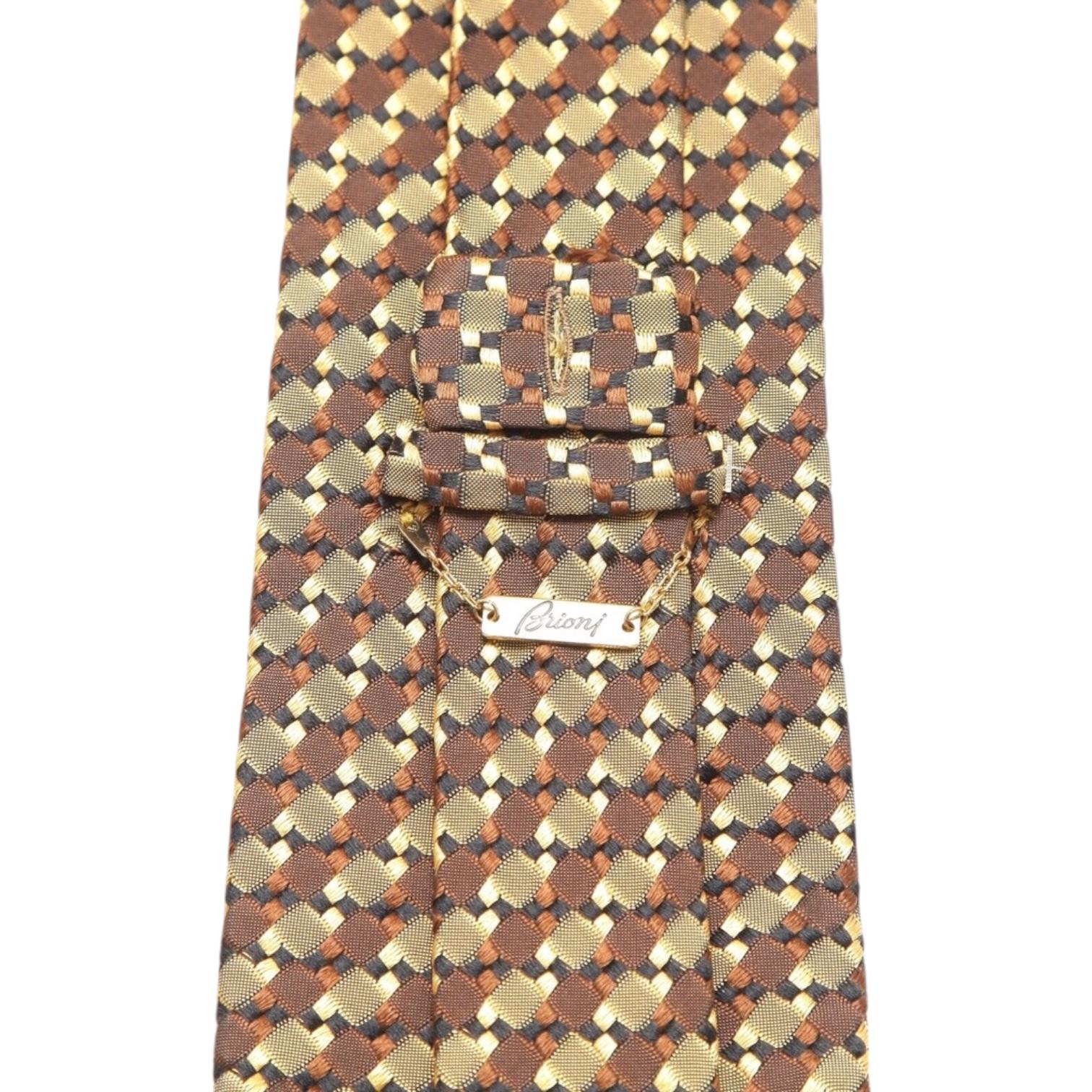 GUARANTEED AUTHENTIC BRIONI MEN'S SILK TIE

 • Design: 
   - Multi-color gold, brown and black.
   - Has a loop with a button hole to place on shirt button to hold in place.
   - Packaged carefully, box not available.

 • Measurements (Approximate