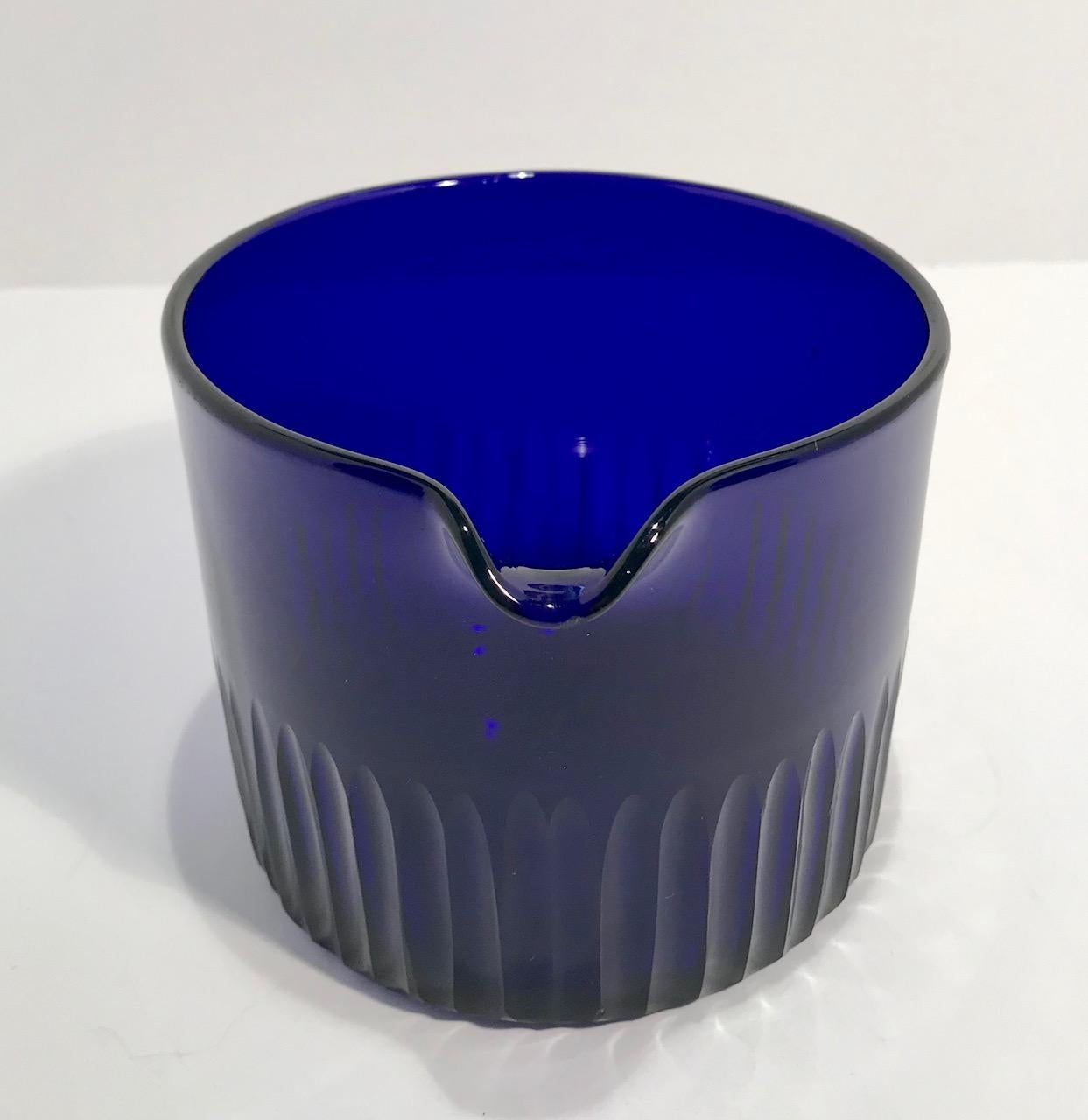 Handblown Bristol (cobalt) blue wine rinse with a single lip. Fluting around the base and a polished pontil on the underside. This hard to find form has the most brilliant deep blue almost purple coloring.

(This item is eligible for a gift box)
