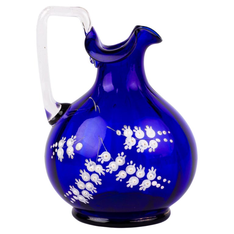 https://a.1stdibscdn.com/bristol-blue-victorian-glass-ewer-19th-century-for-sale/f_90032/f_364111321696174987339/f_36411132_1696174988212_bg_processed.jpg?width=768