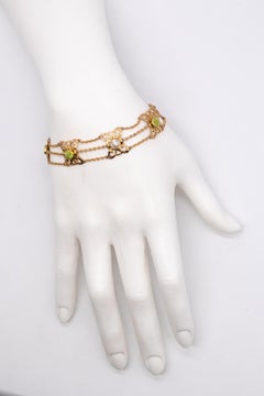 British 1900 Liberty Art and Craft Bracelet in 15 Cts with Pearls and Peridots