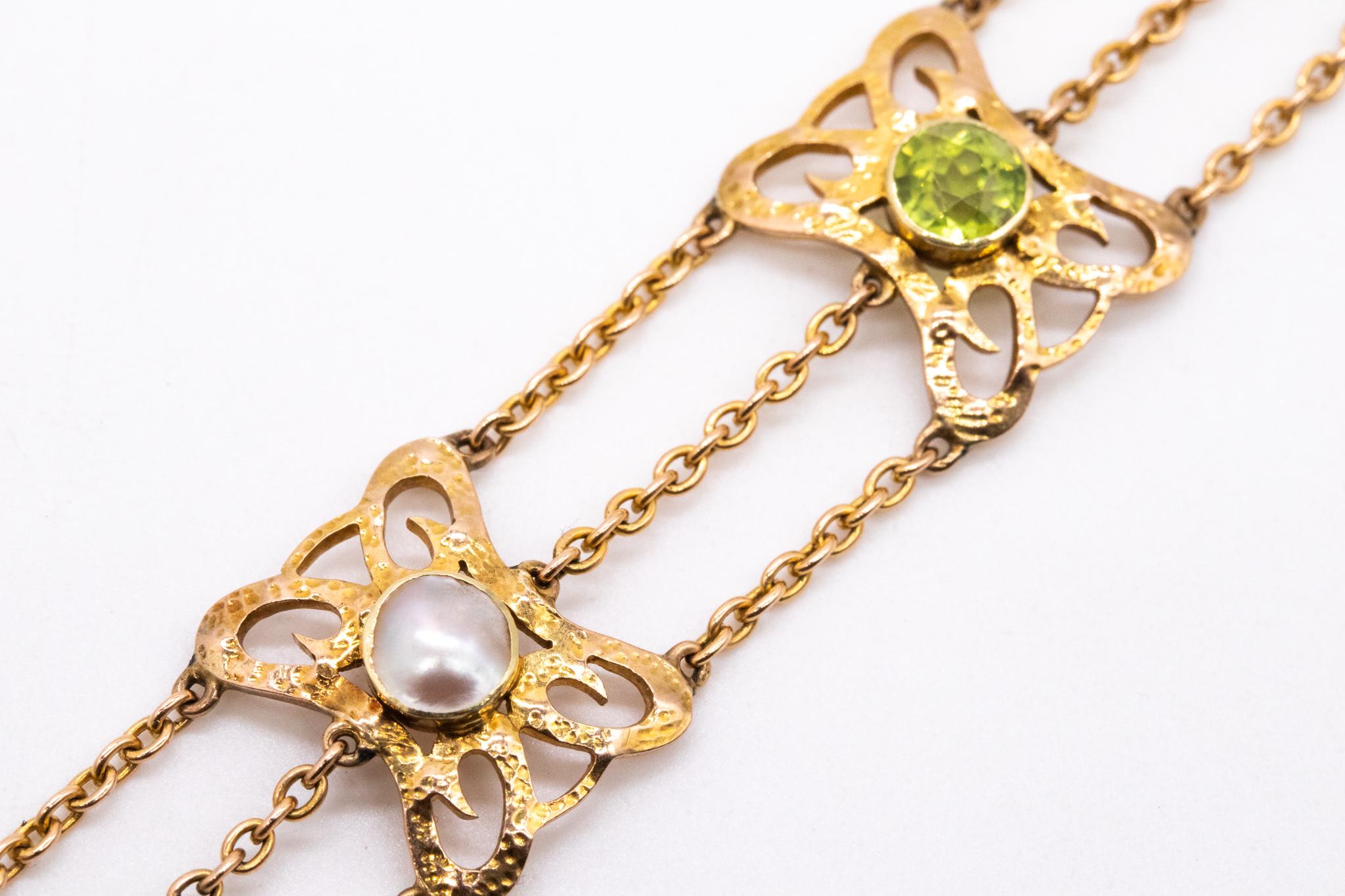 Mixed Cut British 1900 Liberty Art and Craft Bracelet in 15 Cts with Pearls and Peridots For Sale