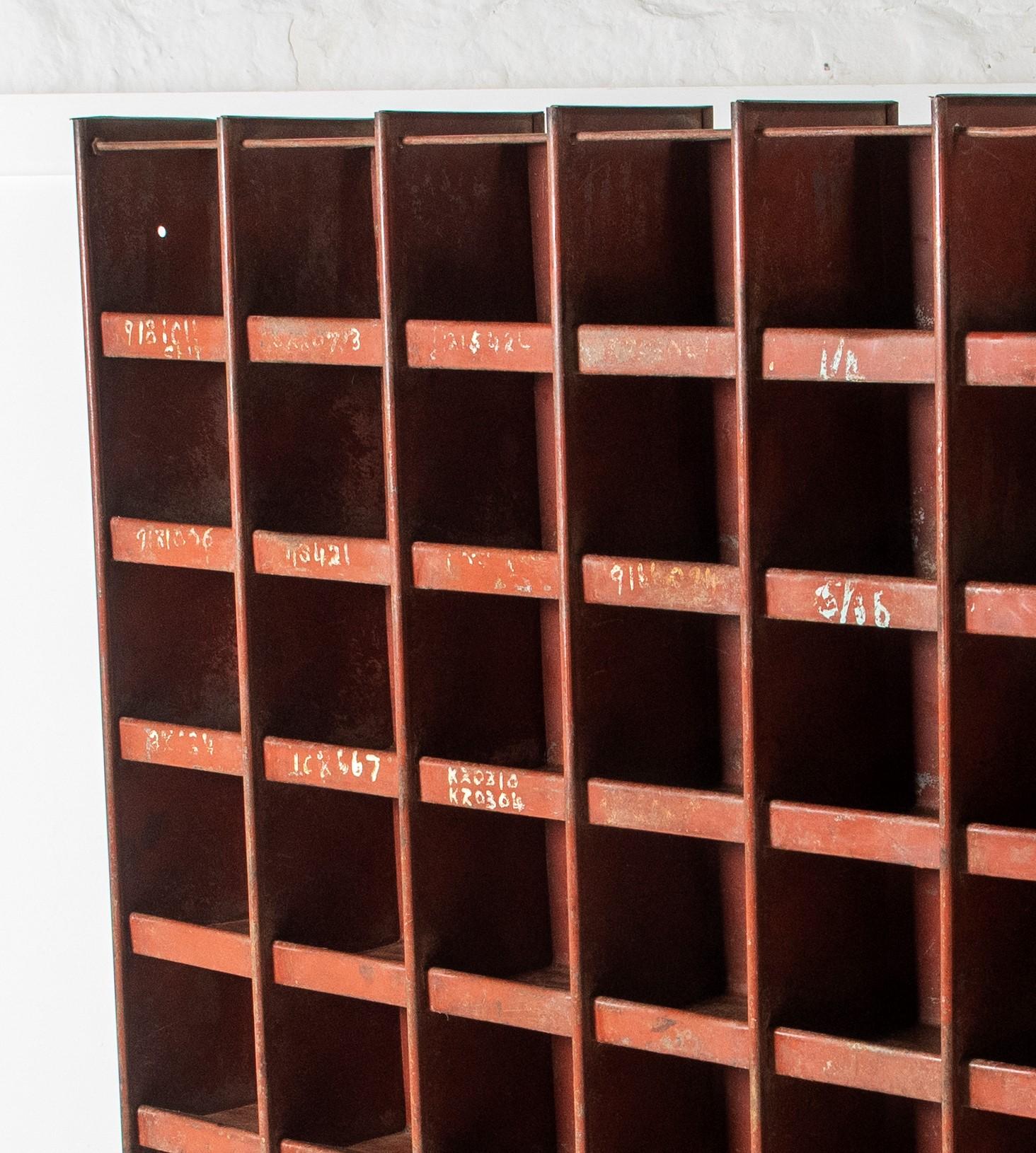 An early 20th century industrial pigeon hole storage unit, good size with 48 pigeon holes. The piece is made using steel rods and bolts and is an early example of industrial furniture pre-dating modern methods of welding. In its original (as found)