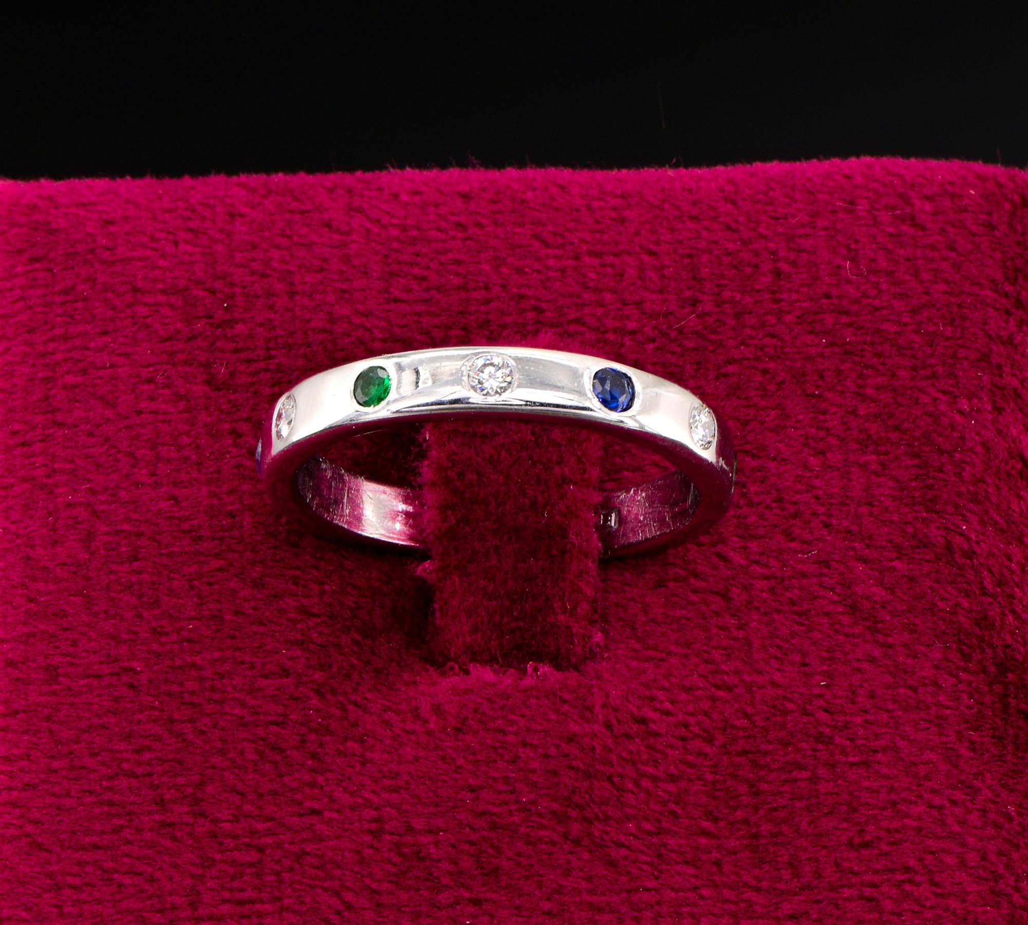 An Unique
Distinctive and pretty different Contemporary full eternity ring bearing British hallmarks
Exquisitely hand crafted of solid 18 Kt gold
Set throughout with alternating natural Emeralds, Sapphires , Diamonds for approx .50 Ct TCW
3 mm in