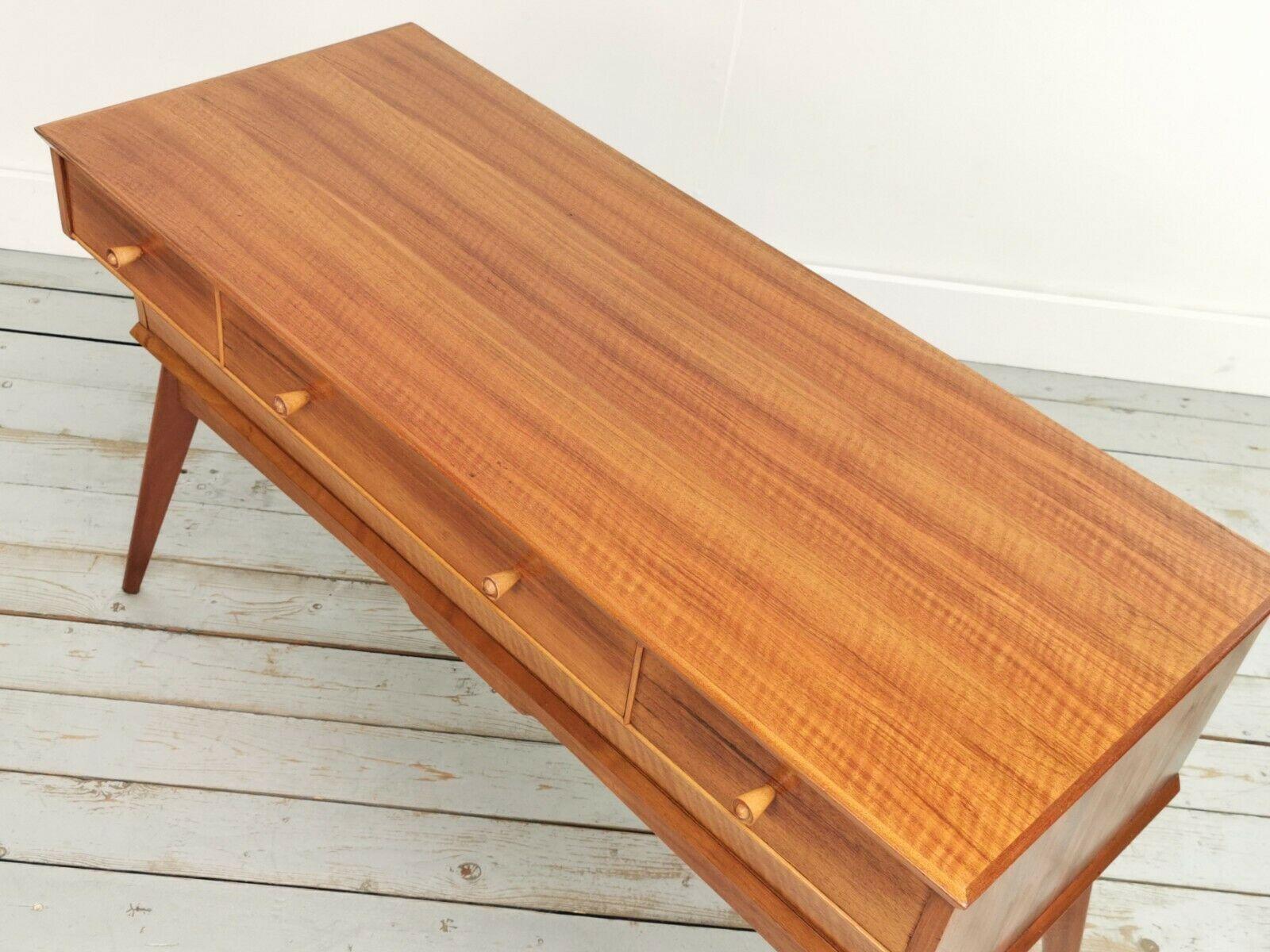 Alfred Cox mid-century sideboard.

Alfred Cox walnut sideboard on raised splayed legs, this item was made by a highly collectable cabinet maker.

Alfred Cox was a great designer of post-war British furniture. He worked mainly with walnut and