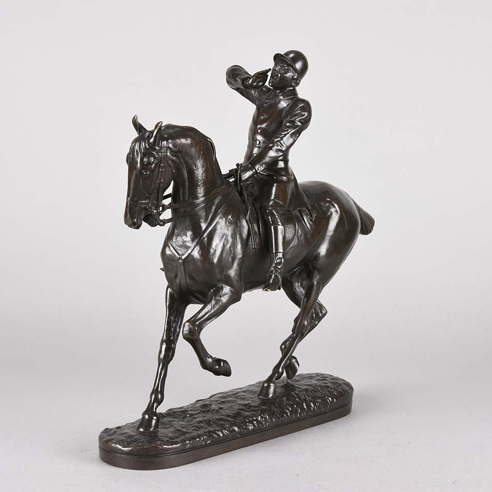A fabulous late 19th century English Animalier bronze study of a huntsman riding his steed calling the hounds with fabulous rich brown and golden patina and very Fine hand chased surface detail, raised on a naturalistic oval base, signed J Willis