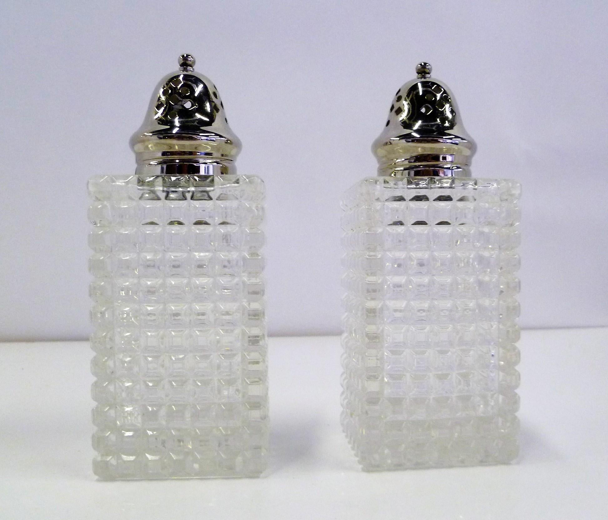 Here a pair of antique, probably Edwardian, English brilliant cut crystal sugar shaker and Muffineer Caster. With their open blocks (Diamonds) pattern and straight sides, they are an elegant and useful addition to any kitchen or table used as salt