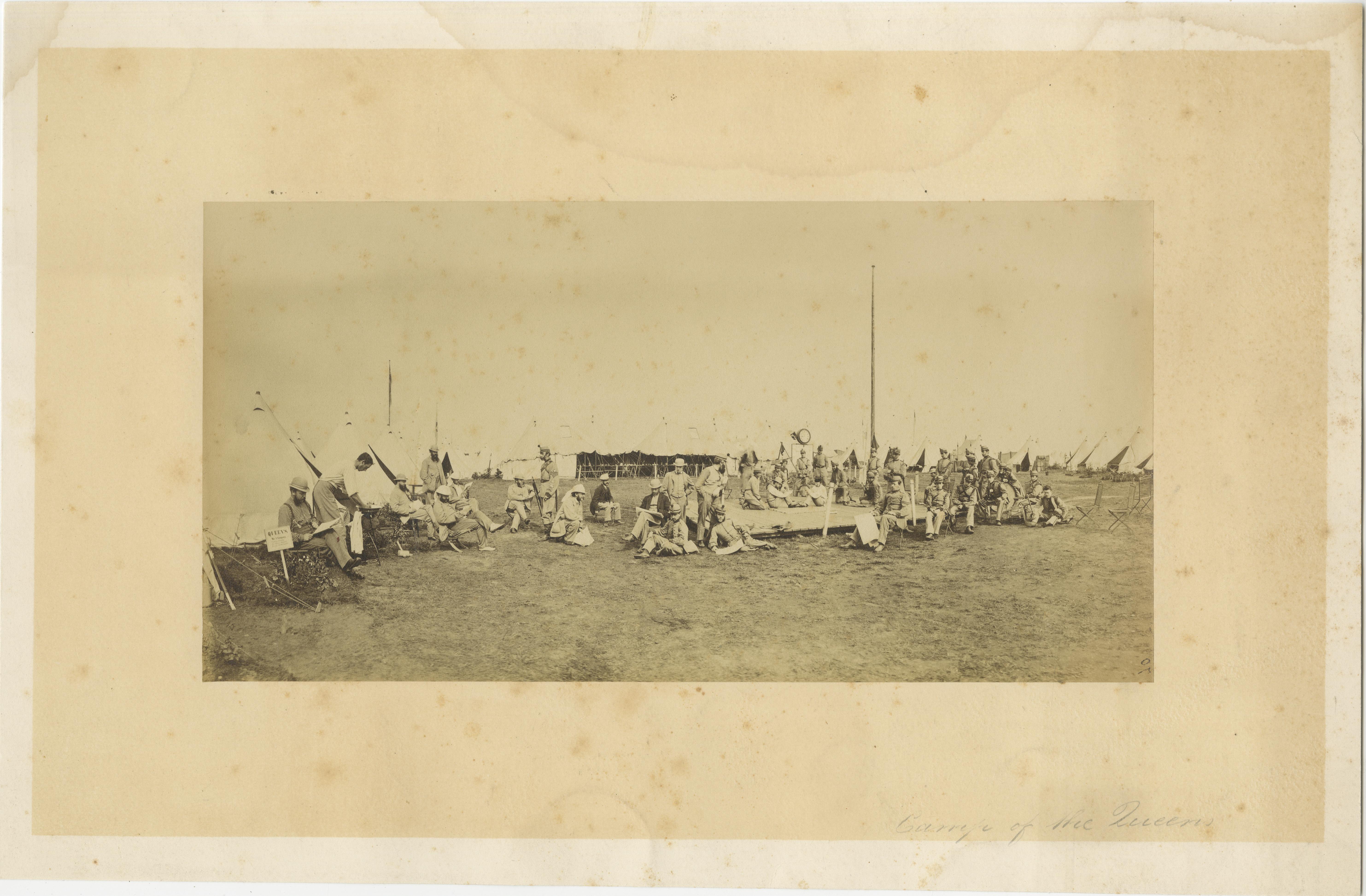 British Army Camp Scenes – Highland and Queen’s Regiments, 19th Century Pair, circa 1870

This is a compelling pair of original 19th-century albumen photographs depicting British Army encampments, likely dating from around 1870. Together, these two