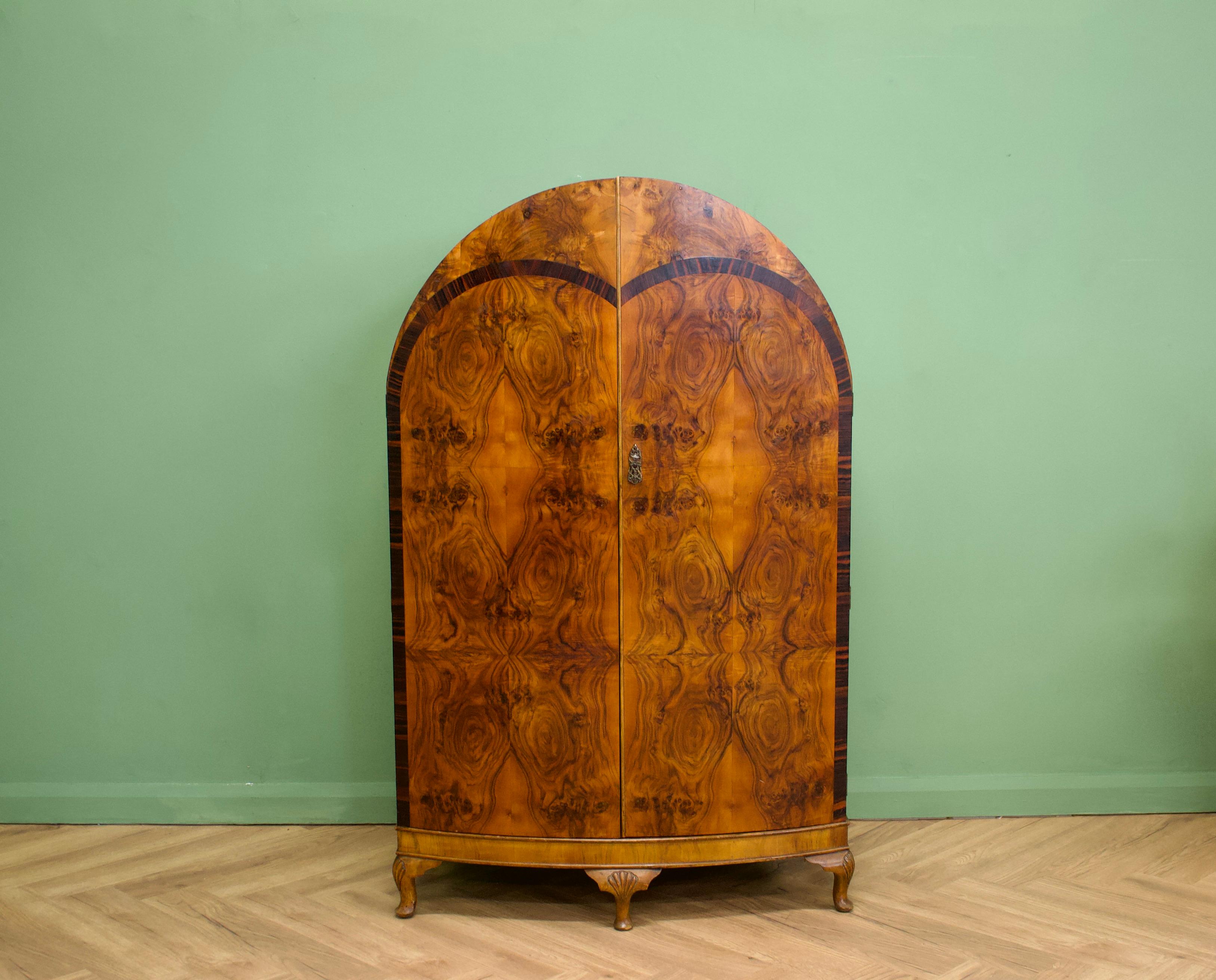 1930s Walnut Compact Wardrobe
An impressive quality 1930s Deco dome topped burr walnut compact wardrobe - it could be used as a linen cabinet
Very similar in style and quality to Waring and Gillow
Featuring internal shelves, shoe rail and hangers.