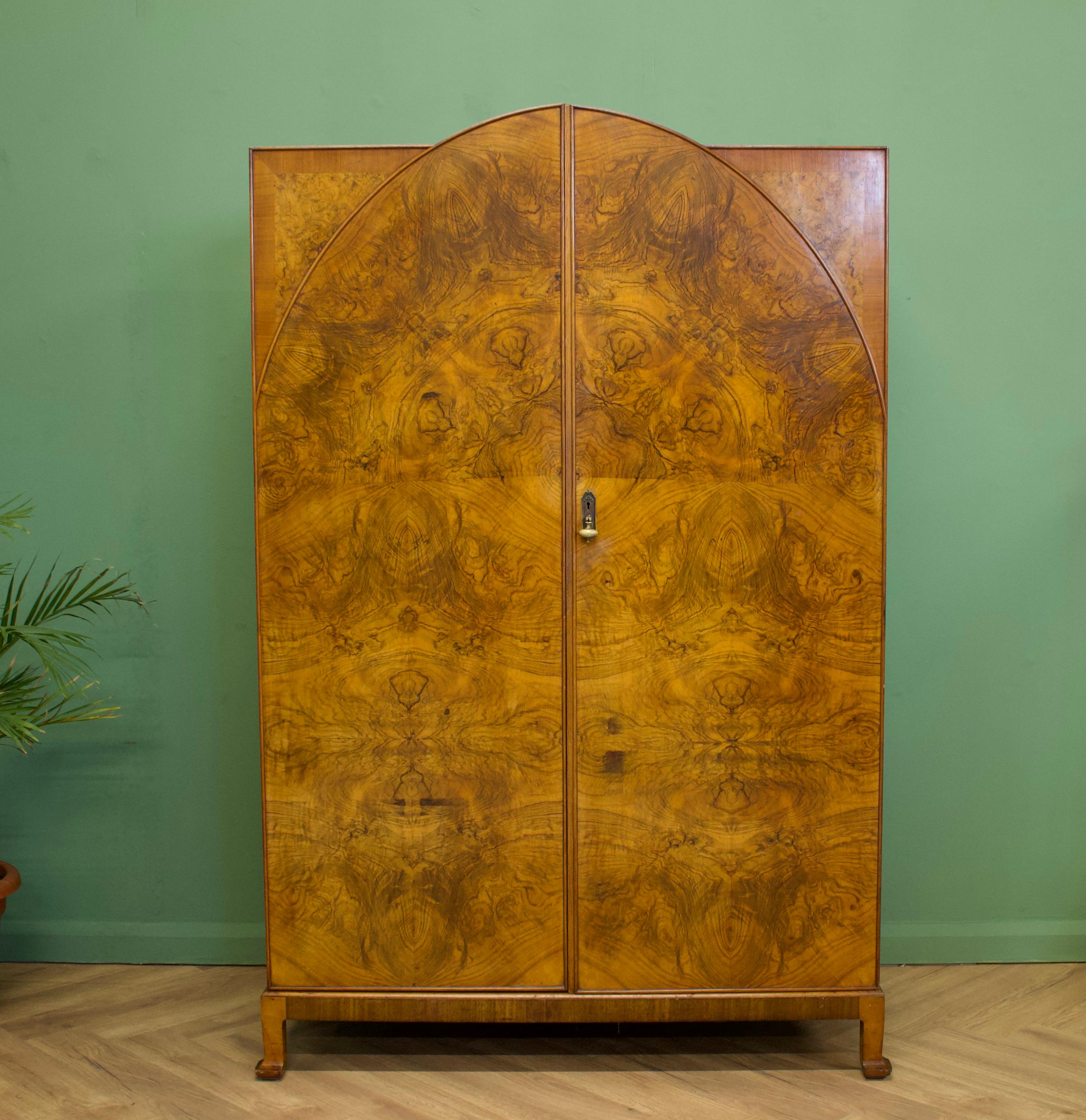 A 1920s Art Deco walnut wardrobe
Featuring a hanging rail, shoe rail, shelves and drawers
Very similar in style and quality to Waring and Gillow.