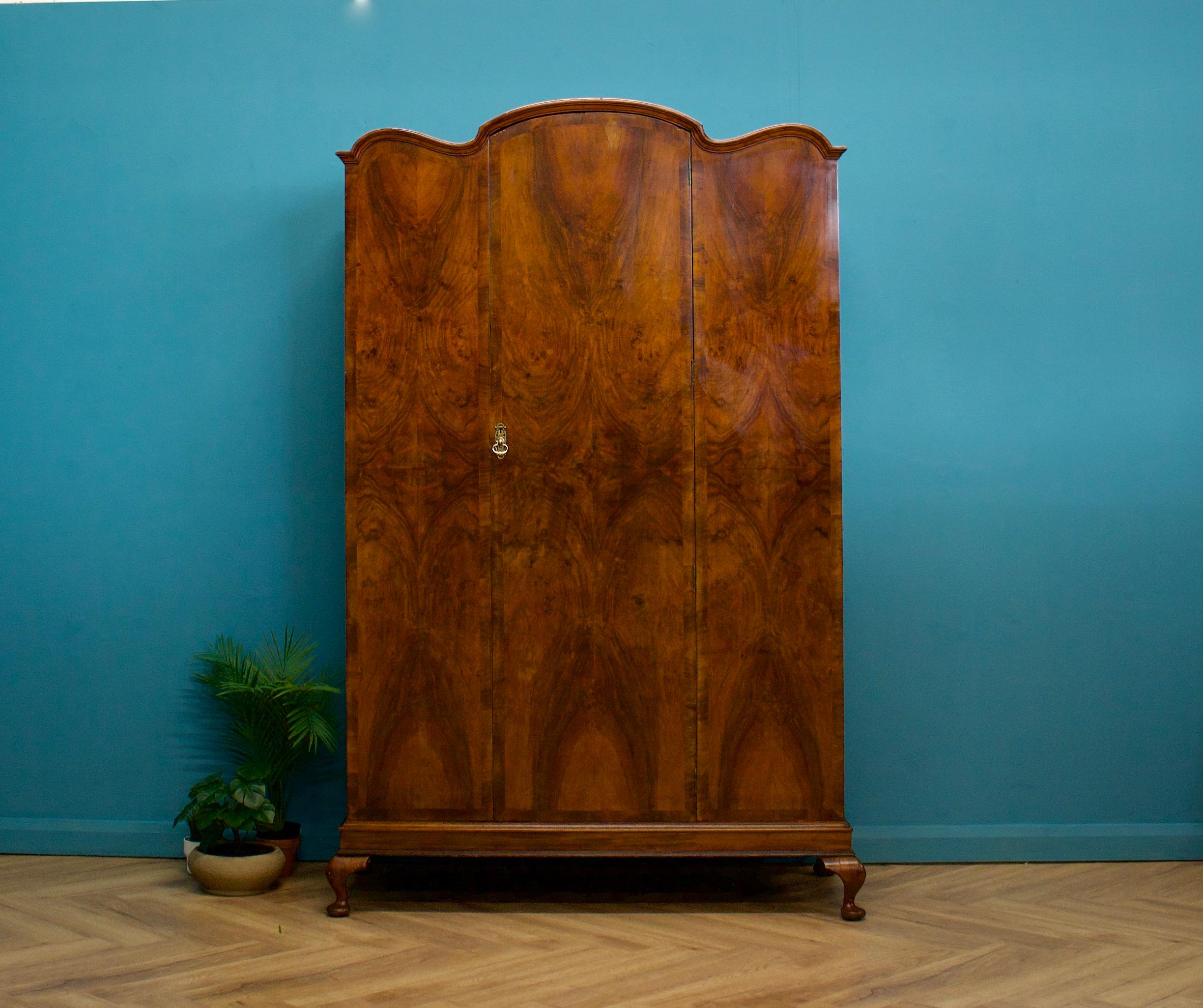An Art Deco walnut wardrobe    - circa 1930's
Fitted out with a clothes rail and a shelf  - there is also a full length mirror attached to one door